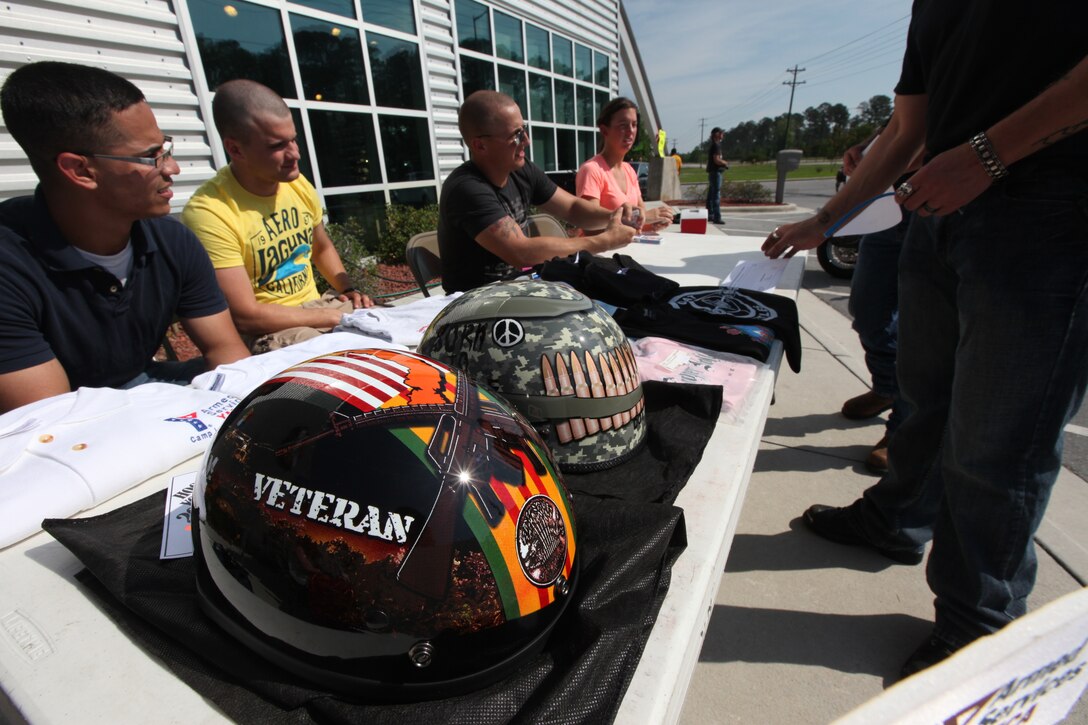 Helmets were some of the many prizes given away during the second annual Poker Run hosted by Armed Services YMCA at New River at New River Harley Davidson Buell motorcycle shop in Jacksonville, N.C., May 5.