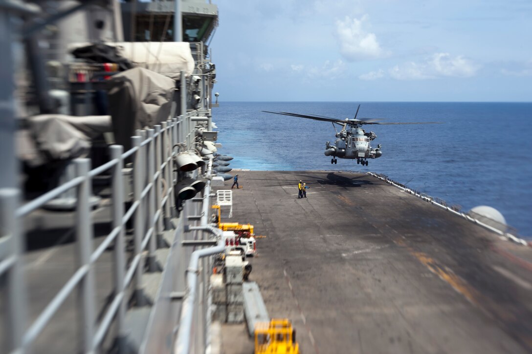 Pilots flying a CH-53E Super Stallion land aboard USS Makin Island here May 12. The pilots serve with Marine Medium Helicopter Squadron 268 (Reinforced), the aviation combat element with the 11th Marine Expeditionary Unit. The unit embarked the ship, as well as USS New Orleans and USS Pearl Harbor in San Diego Nov. 14, beginning a seven-month deployment to the Western Pacific, Horn of Africa and Middle East regions.