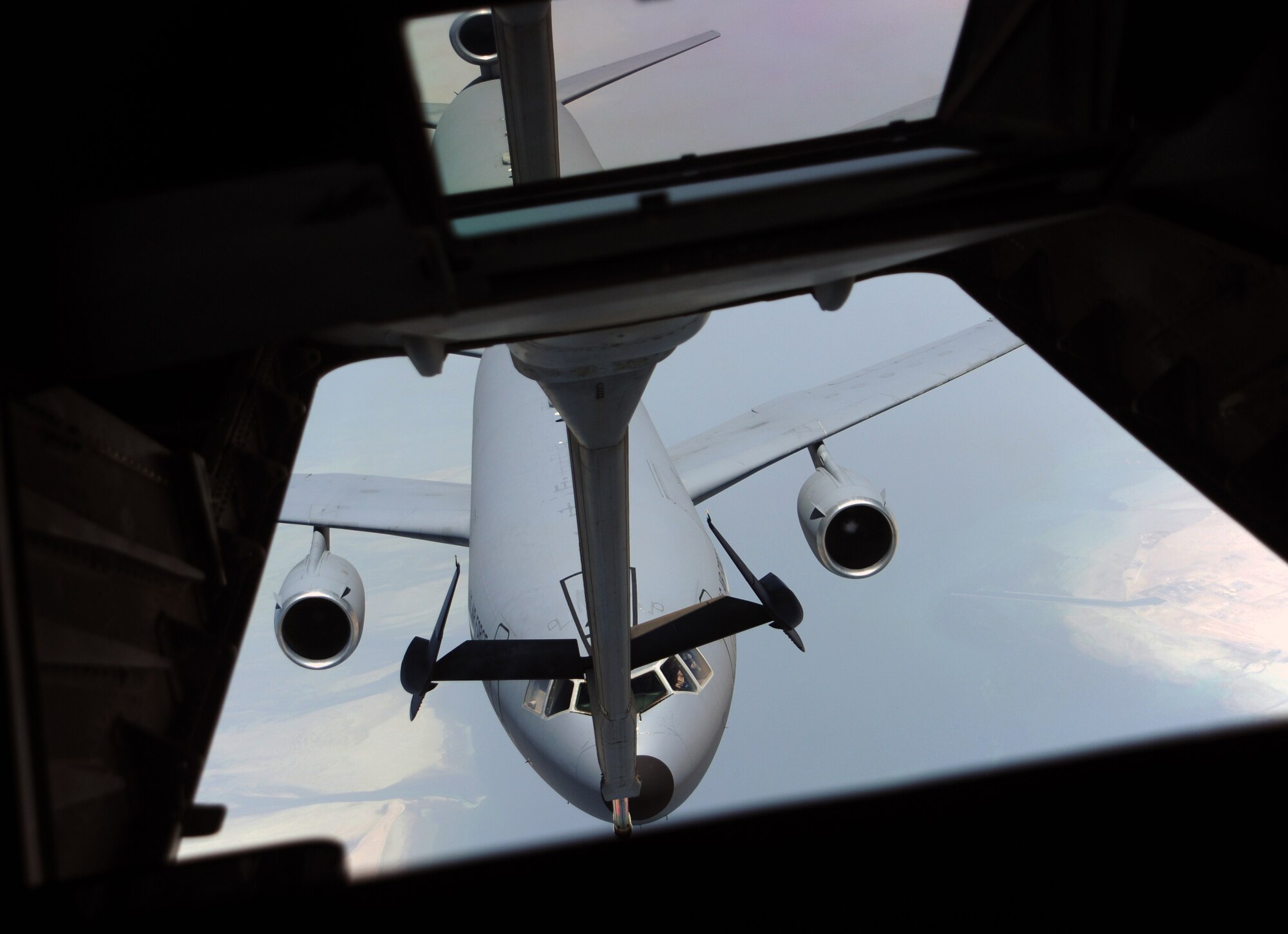 SOUTHWEST ASIA - A KC-10 Extender from the 380th Air Expeditionary Wing approaches another KC-10 for aerial refueling May 11, 2012. Extenders and their crews are able to refuel joint and coalition aircraft as well as carry cargo. During the month of April, the squadron offloaded 23.5 million pounds of fuel over 285 sorties to 2,137 receivers. Both jets and their crews are deployed from Joint Base McGuire-Dix-Lakehurst. (U.S. Air Force photo/Staff Sgt. J.G. Buzanowski)
