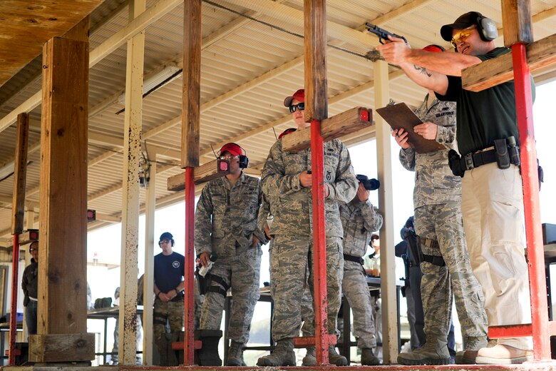 VANDENBERG AIR FORCE BASE, Calif.-- Tech. Sgt. Sean Yargus, a 30th Security Forces Squadron conservation officer, shoots at targets during a pistol competition at the combat arms training range here Monday, May 14, 2012. The competition was held in conjunction with National Police Week, an annual celebration that recognizes the service and sacrifice of U.S. law enforcement personnel. (U.S. Air Force photo/Staff Sgt. Levi Riendeau)
