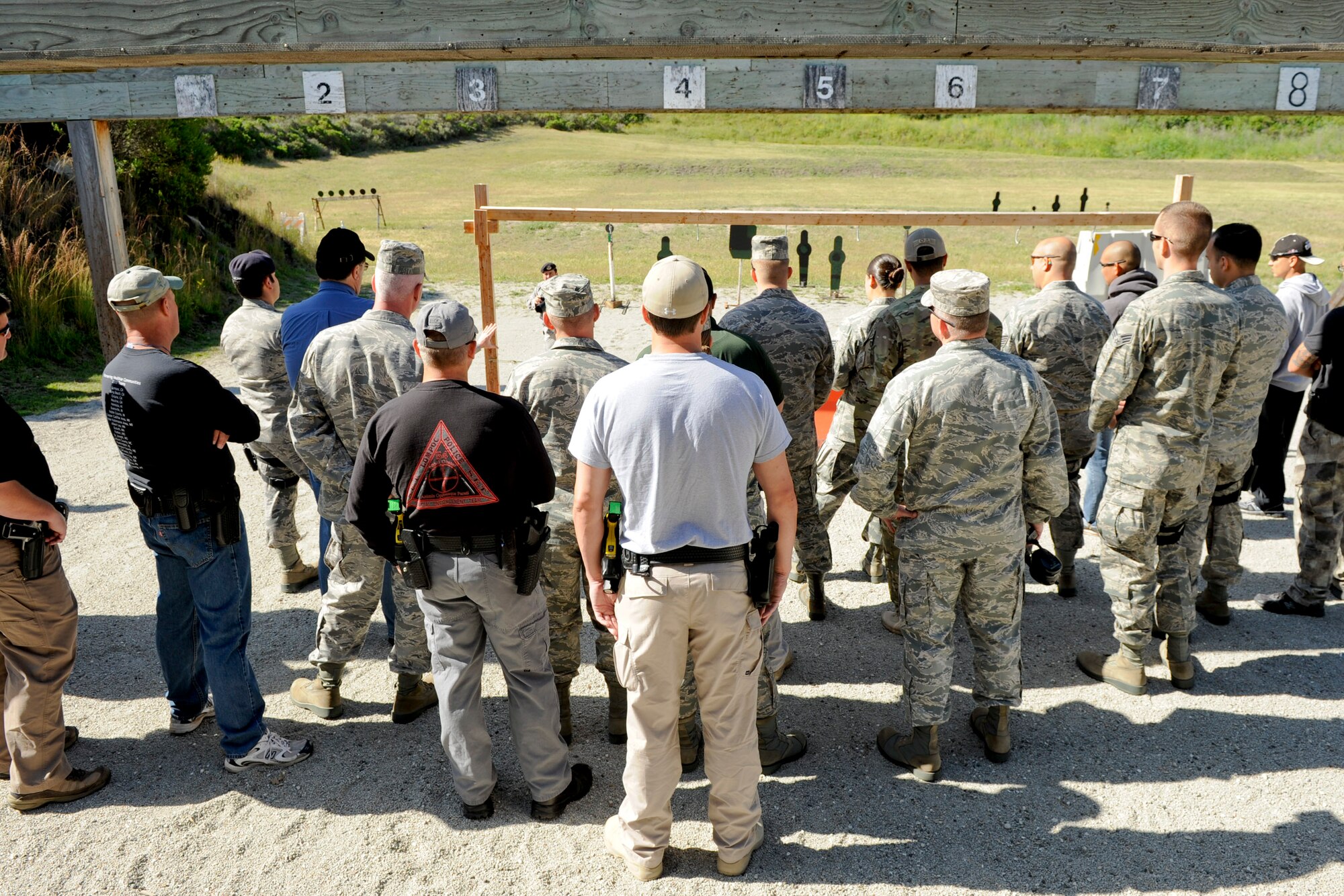 VANDENBERG AIR FORCE BASE, Calif.-- Participants observe the course of a pistol competition at the combat arms training range here Monday, May 14, 2012. The competition was held in conjunction with National Police Week, an annual celebration that recognizes the service and sacrifice of U.S. law enforcement personnel. (U.S. Air Force photo/Staff Sgt. Levi Riendeau)
