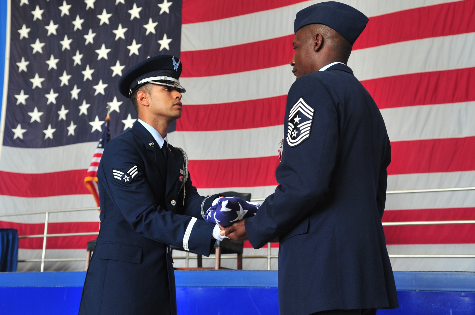U.S. Air Force Chief Master Sgt. Lefford Fate, 20th Fighter Wing command chief, receives a folded flag during his retirement ceremony, Shaw Air Force Base, S.C. May 1, 2012. Fate enlisted in the Air Force in 1982 and has a wide variety of military background and experience. Fate retired after 30 years of service.  (U.S. Air Force photo by Airman 1st Class Ashley L. Gardner/ Released)