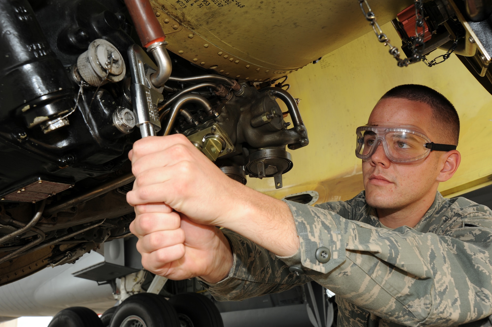 Senior Airman Ryan Haught, 22nd Aircraft Maintenance Squadron aircraft electrical and environmental systems journeyman, removes an aircraft generator May 11, 2012, McConnell Air Force Base, Kan. As an aircraft electrical and environmental systems journeyman, Haught is responsible for testing, inspecting, repairing and maintaining electrical and environmental systems such as anti-ice, heating, cooling, pressurization, anti-skid, lighting and fire detection systems. Haught was chosen as the 22nd AMXS spotlight performer of the week, April 30 to May 4. (U. S. Air Force photo/ Airman 1st Class Jose L. Leon)