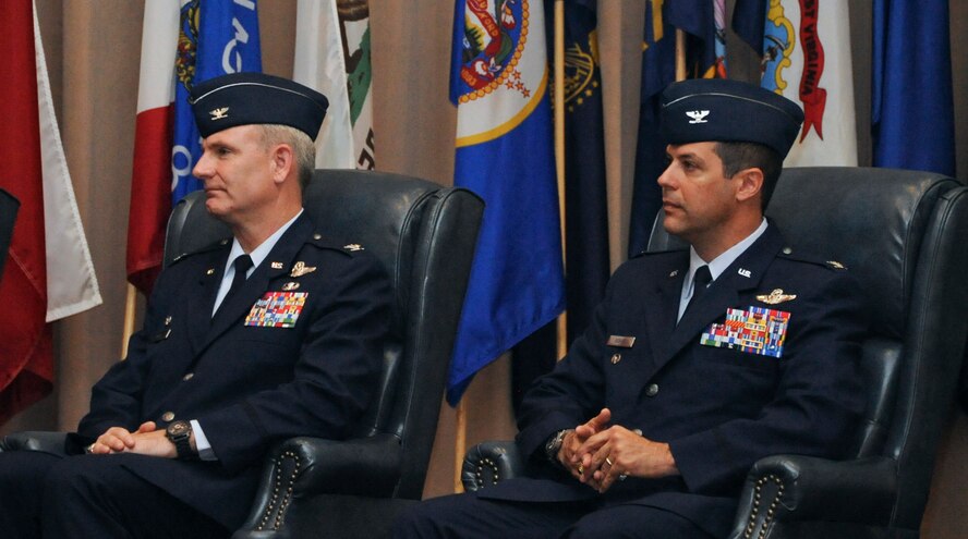 Col. Tim Fay, outgoing 2nd Bomb Wing commander, and Col. Andrew Gebara, incoming 2 BW commander, listen as Maj. Gen. Stephen Wilson, 8th Air Force commander, gives a speech about leadership during the 2 BW change-of-command ceremony on Barksdale Air Force Base, La., May 14. During the ceremony, Fay was presented the Legion of Merit for his contributions to the wing and the Air Force during his time at Barksdale. (U.S. Air Force photo/Airman 1st Class Micaiah Anthony)(RELEASED) 