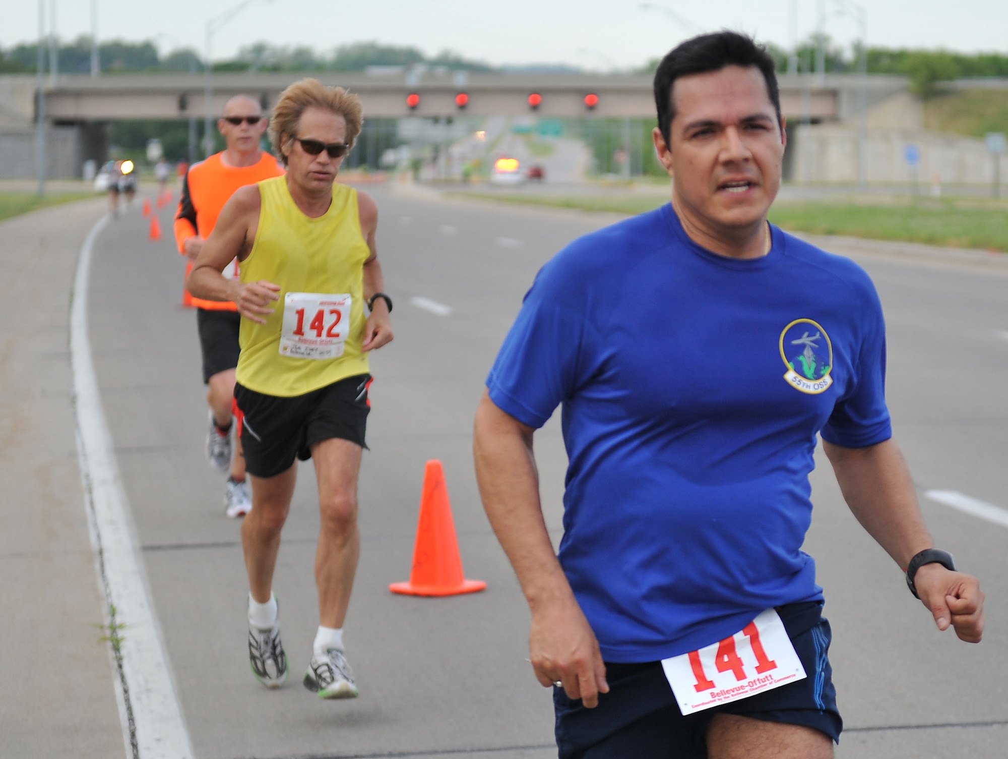 Carlos Centeno of Omaha leads the pack with Joe Ivey of Bellevue not far behind at the Bellevue-Offutt Runway Run in Bellevue, Neb., May 13. Approximately 200 runners took advantage of a beautiful day to run the race. (U.S. Air Force photo by Jeff W. Gates/Released)