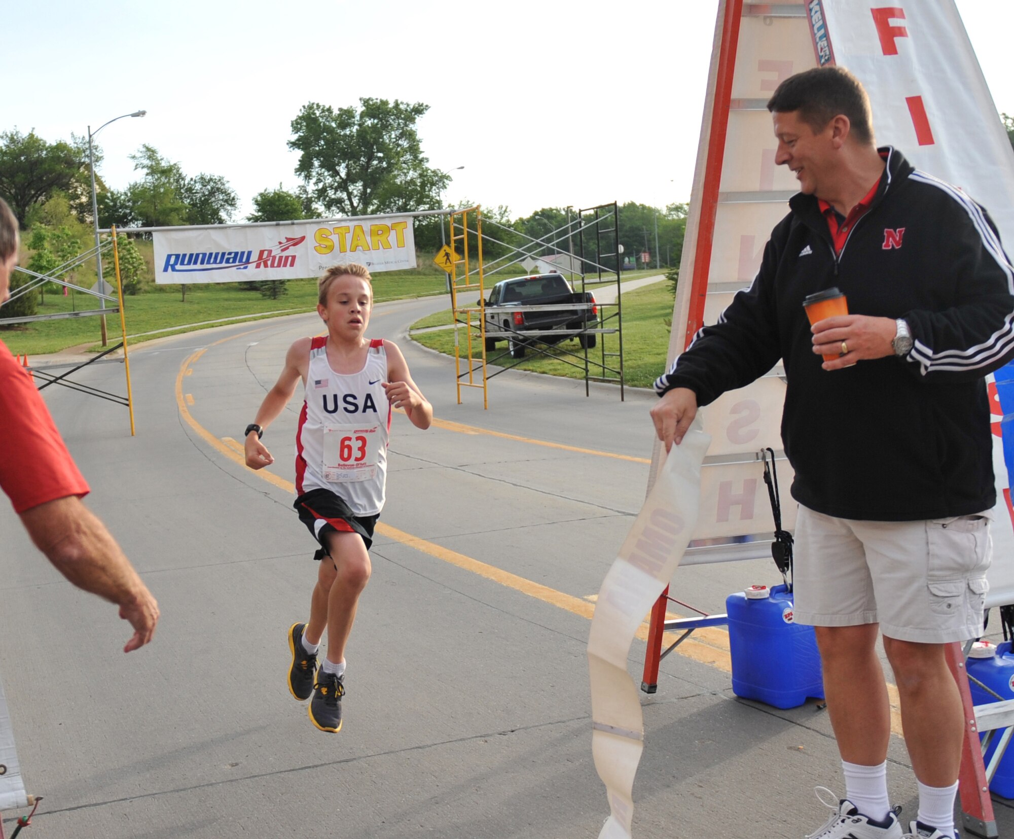 Justin Liedke of Papillion, Neb., finishes first out of approximately 200 runners at this year's Bellevue-Offutt Runway Run in Bellevue, Neb., May 13. This was the fifth annual event. (U.S. Air Force photo by Jeff W. Gates/Released)