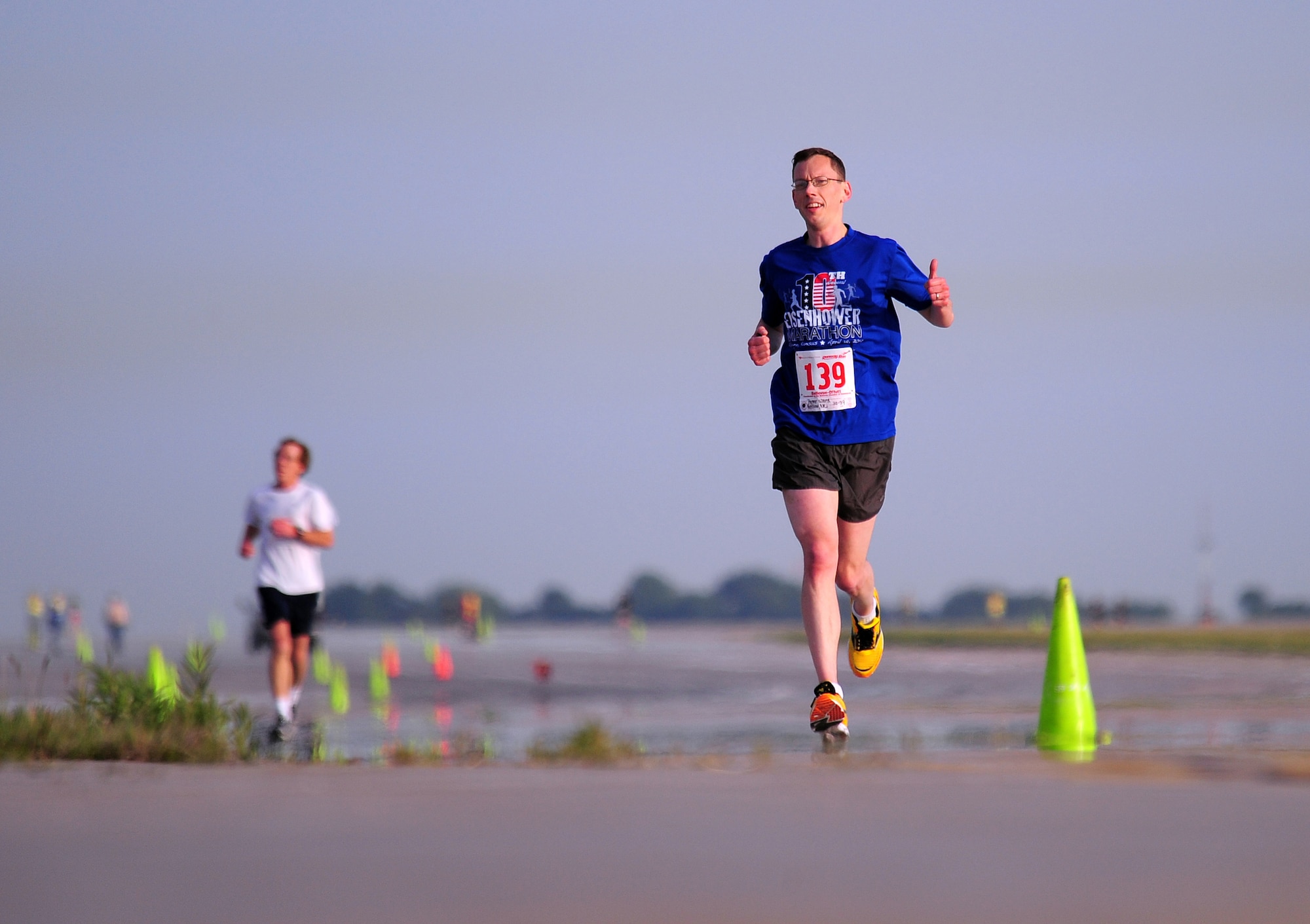 Peter Ward gives thumbs up as he participates in the annual Bellevue-Offutt Runway Run at Offutt Air Force Base, Neb., May 13. Nearly 200 runners participated in this year's race. (U.S. Air Force Photo by Josh Plueger)