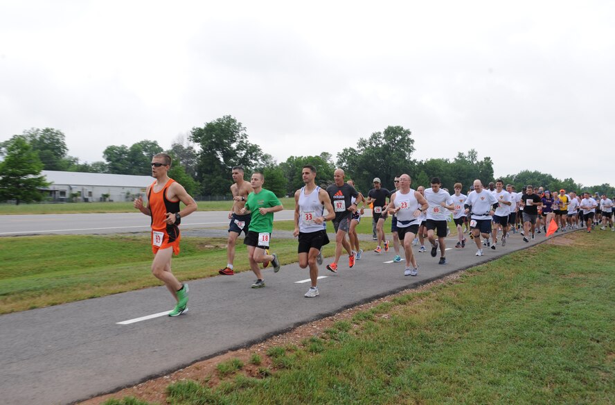 Runners take off at the start of the inaugural Mighty Eighth 8 Miler on Barksdale Air Force Base, La., May 12. More than 110 base personnel and sponsored guests participated in the eight-mile run or a 5 k event. (U.S. Air Force photo/Airman 1st Class Benjamin Gonsier)(RELEASED)
