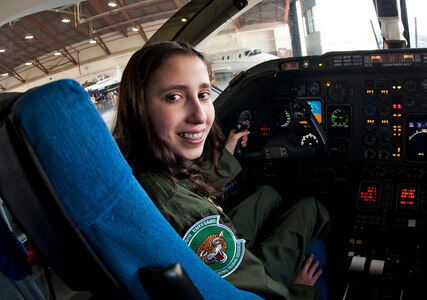 Lindsey Stange, a New Braunsfels High School student and recovering cancer patient, sits in the cockpit of a T-1 aircraft as she takes part in the Pilot for a Day program May 11 at Joint Base San Antonio-Randolph, Texas. (U.S. Air Force photo by Benjamin Faske)