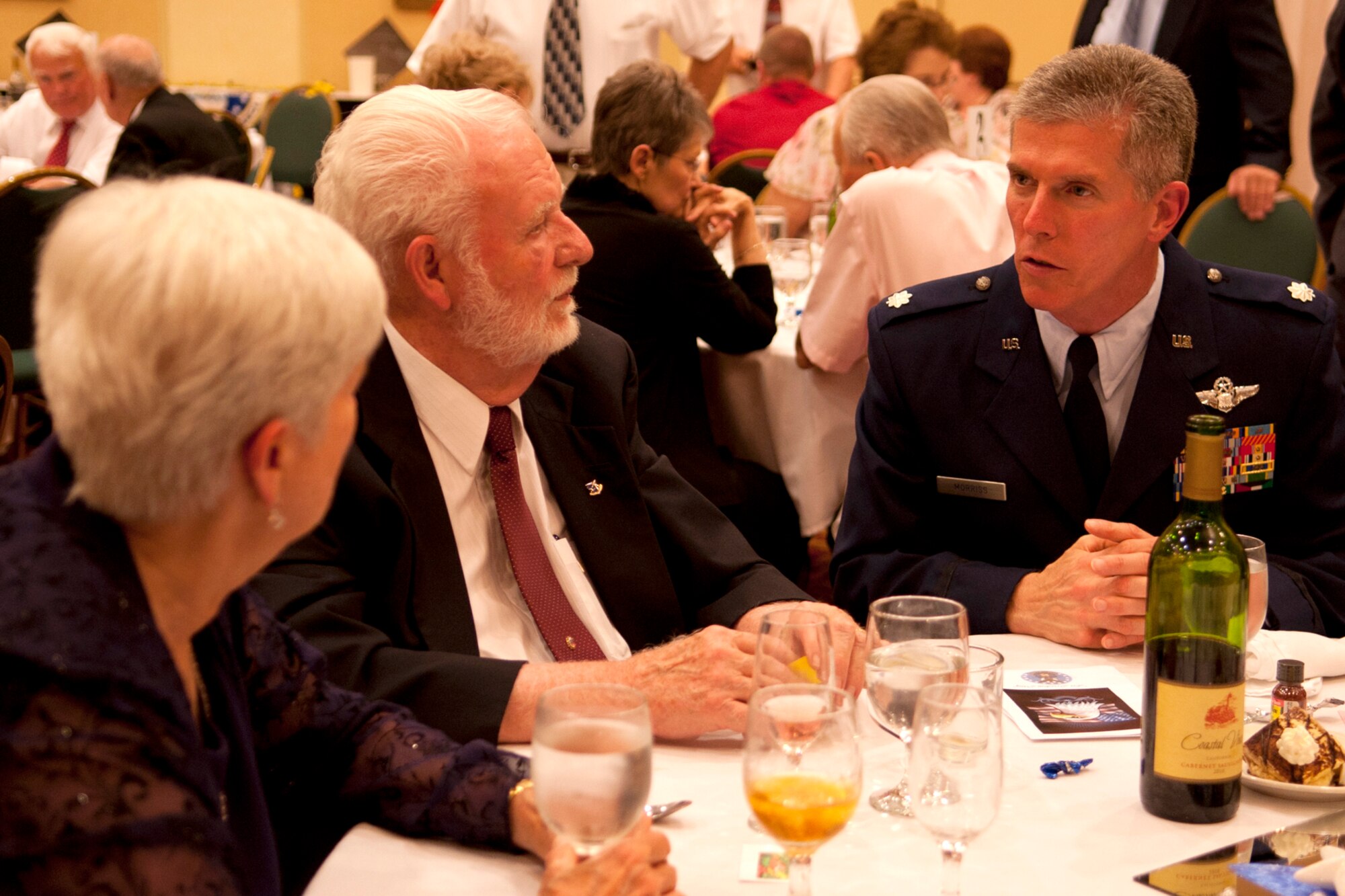 U.S. Air Force Lt. Col. James Morriss, 307th Operations Group deputy commander, Talks with Larry Boggess during the 307th Bomb Wing Association reunion banquet at Lincoln, Neb., May 5, 2012. Boggess was assigned to the 307th Bombardment Wing at Lincoln Air Force Base from 1956 to 1962 and was a navigator on the B-47 Stratojet. (U.S. Air Force photo by Master Sgt. Greg Steele/Released)