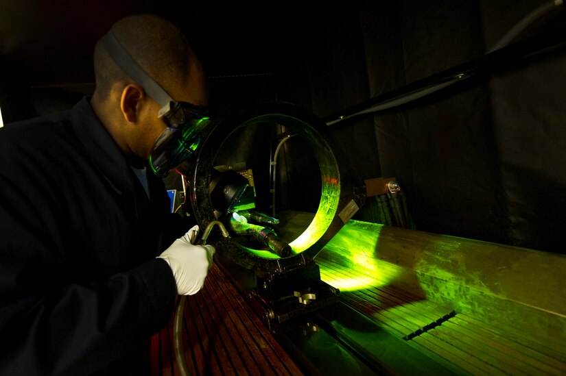 Staff Sgt. Evan Kidd, a non-destructive inspector with the 437th Maintenance Squadron out of Joint Base Charleston, S.C., performs a magnetic particle inspection on a hook May 9, 2012. The inspection tests for fractures in the metal. (U.S. Air Force photo/Airman 1st Class George Goslin)
