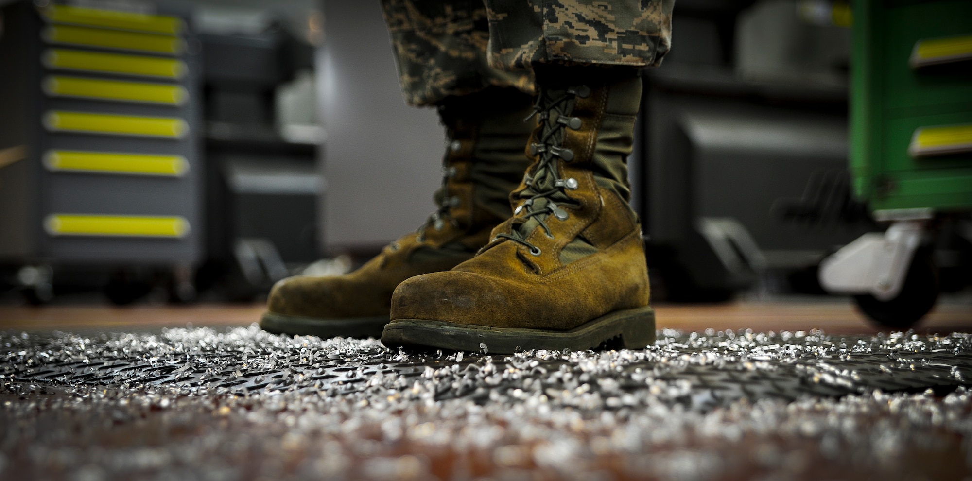 Airman 1st Class Tashma Antoine, an aircraft metals apprentice with the 437th Maintenance Squadron out of Joint Base Charleston, S.C., is surrounded by metal shavings after using a lathe to reduce the height of a block of metal on May 9, 2012. Antoine works in the aircraft metals fabrication shop where he uses several different pieces of equipment to bend, cut and combine metals together. Antoine is originally from Fort Myers, Fla. (U.S. Air Force photo/Airman 1st Class Dennis Sloan)