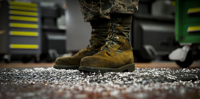 Airman 1st Class Tashma Antoine, an aircraft metals apprentice with the 437th Maintenance Squadron out of Joint Base Charleston, S.C., is surrounded by metal shavings after using a lathe to reduce the height of a block of metal on May 9, 2012. Antoine works in the aircraft metals fabrication shop where he uses several different pieces of equipment to bend, cut and combine metals together. Antoine is originally from Fort Myers, Fla. (U.S. Air Force photo/Airman 1st Class Dennis Sloan)