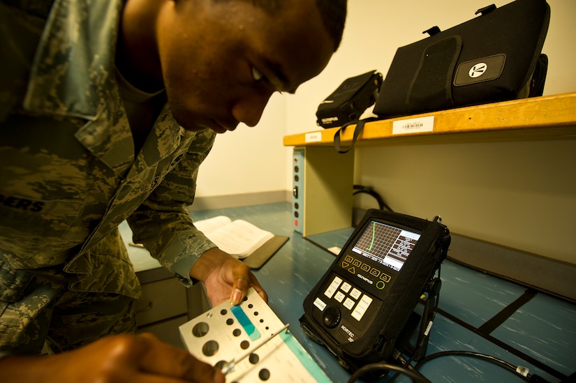 Airman 1st Class James Rogers, a non-destructive inspector with the 437th Maintenance Squadron out of Joint Base Charleston, S.C., demonstrates the use of the Nortec 2000D+ at JB Charleston - Air Base, S.C. on May 9, 2012. The instrument is another method the Airmen have to detect cracks and flaws in metal. (U.S. Air Force photo/Airman 1st Class George Goslin)