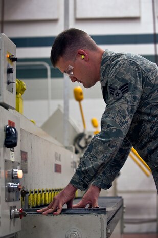 Senior Airman Jacob Carey, an aircraft metals technology journeyman with the 437th Maintenance Squadron out of Joint Base Charleston, S.C., cuts a sheet of metal May 9, 2012. Aircraft metals specialists perform functions such as gas and electric welding, milling, machining, grinding metal, or using precision measuring devices. (U.S. Air Force photo/Airman 1st Class George Goslin)