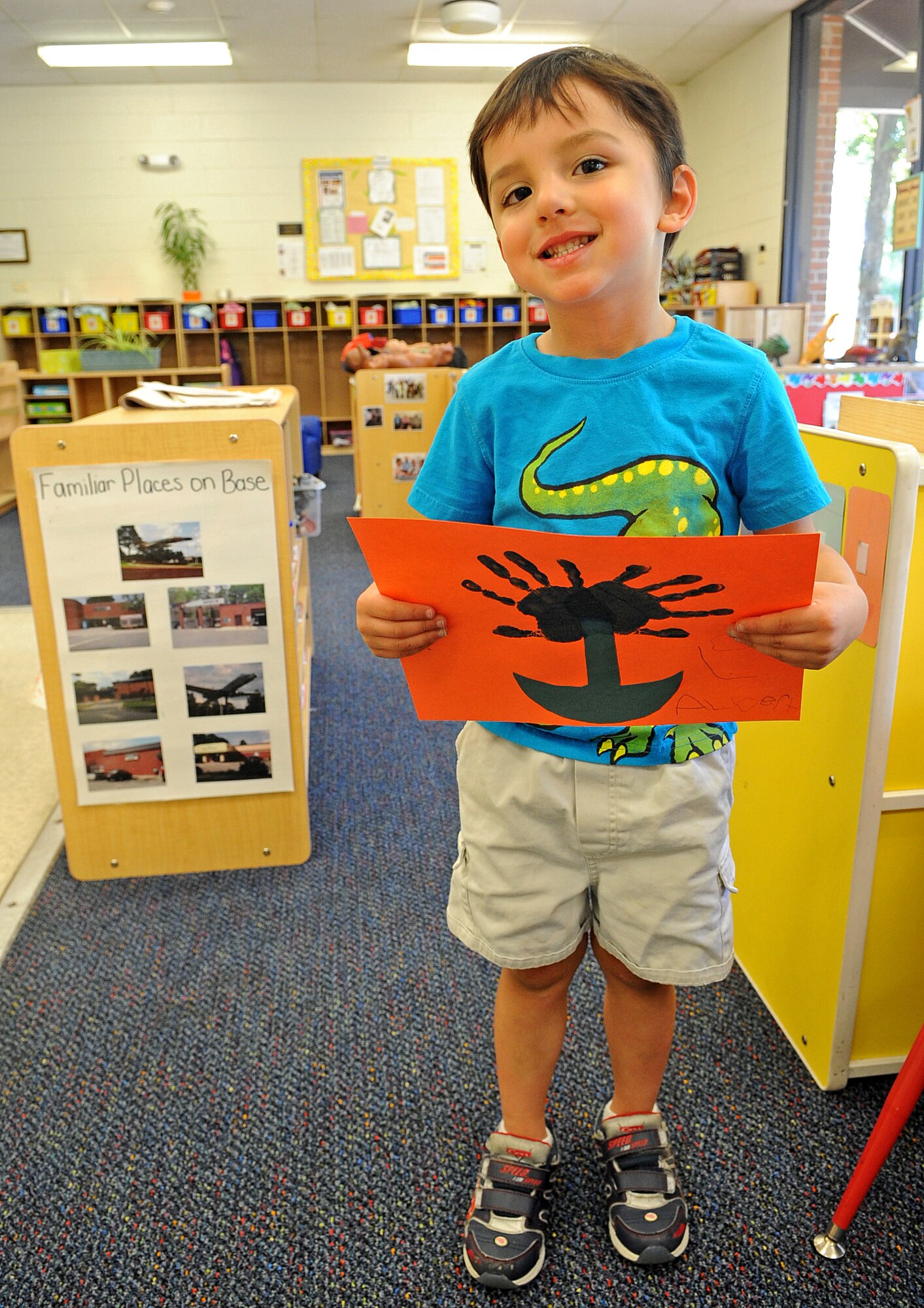 Albert Joseph, 4, holds a handprint flower he made as a Mother’s Day gift at the child development center on Seymour Johnson Air Force Base, N.C., May 11, 2012. Albert appreciates his mother because she surprises him with toys when he is sad. Albert is the son of Staff Sgt. Amber Joseph, 4th Logistics Readiness Squadron. (U.S. Air Force photo/Airman 1st Class Aubrey Robinson/Released)