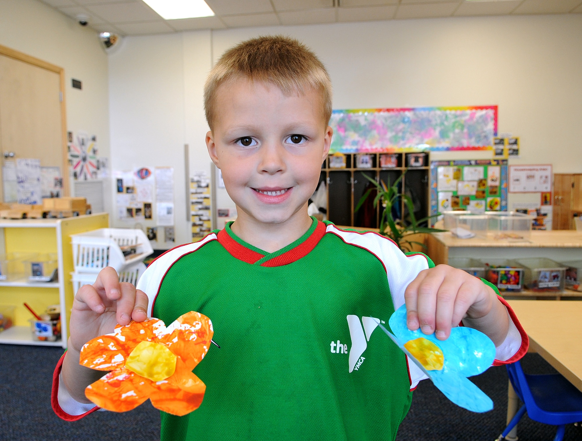 Pierce McCardle, 5, holds flowers he painted as a Mother’s Day gift at the child development center on Seymour Johnson Air Force Base, N.C., May 10, 2012. According to Pierce, Mother’s Day is a time to be special to his mom because she gives him kisses and reads stories to him at bedtime. Pierce is the son of Staff Sgt. David McCardle, 4th Civil Engineer Squadron. (U.S. Air Force photo/Airman 1st Class Aubrey Robinson/Released)