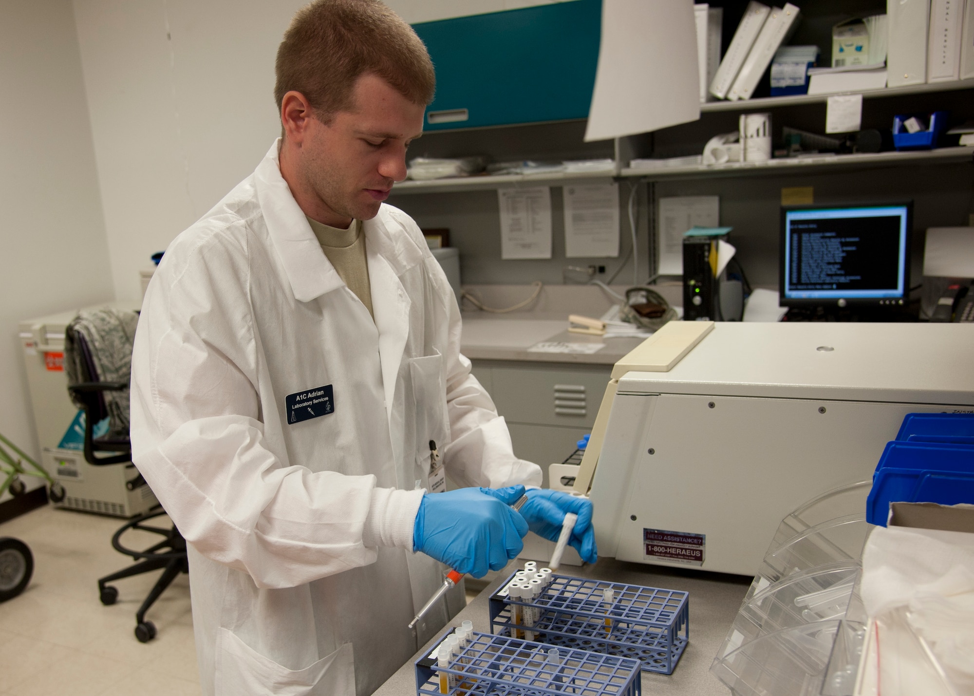 HOLLOMAN AIR FORCE BASE, N.M. — Airman 1st Class Devin Adrian, 49th Medical Support Squadron laboratory technician, checks blood samples from patients April 25 at the medical laboratory. The medical laboratory is certified by the College of America Pathologists. The certification means Holloman’s laboratory has good lab practices, follows Occupational Safety and Health Administration rules, and maintains good quality control that produces accurate results. (U.S. Air Force photo by Airman 1st Class Colin Cates/Released) 