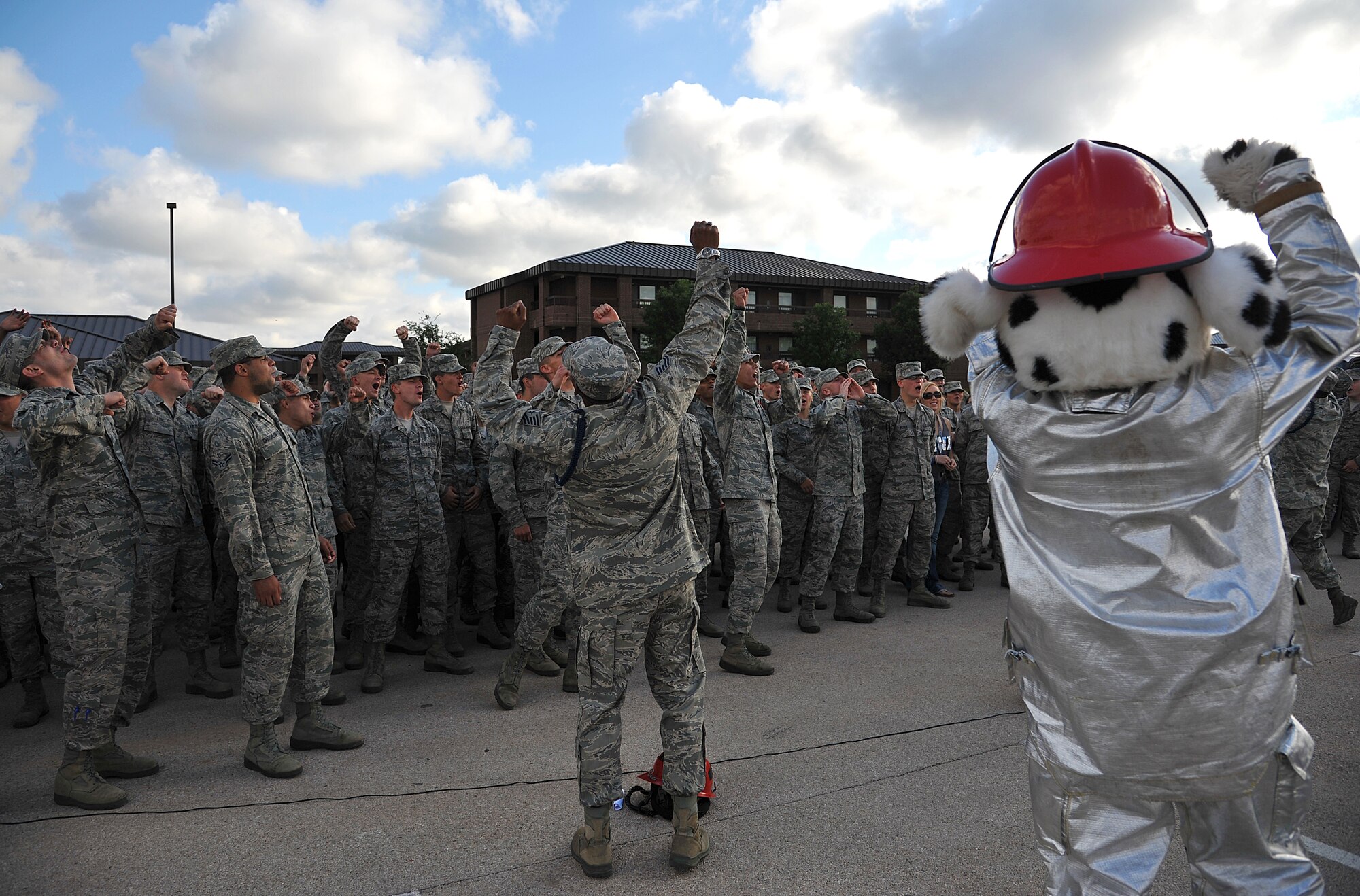 GOODFELLOW AIR FORCE BASE, Texas-- Sparky, the fire dog, helps pump up the 312th Training Squadron students and instructors at the drill competition May 12. The 312th TRS came together and won the competitions spirit award. (U.S. Air Force photo/Airman 1st Class Michael Smith)