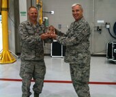 Col. Ken Bunting (left), 916th Maintenance Group commander, receives the 4th Air Force Maintenance Effectiveness Award from Col. during the wing's May unit training assembly weekend. (USAF photo courtesy 916MXG)