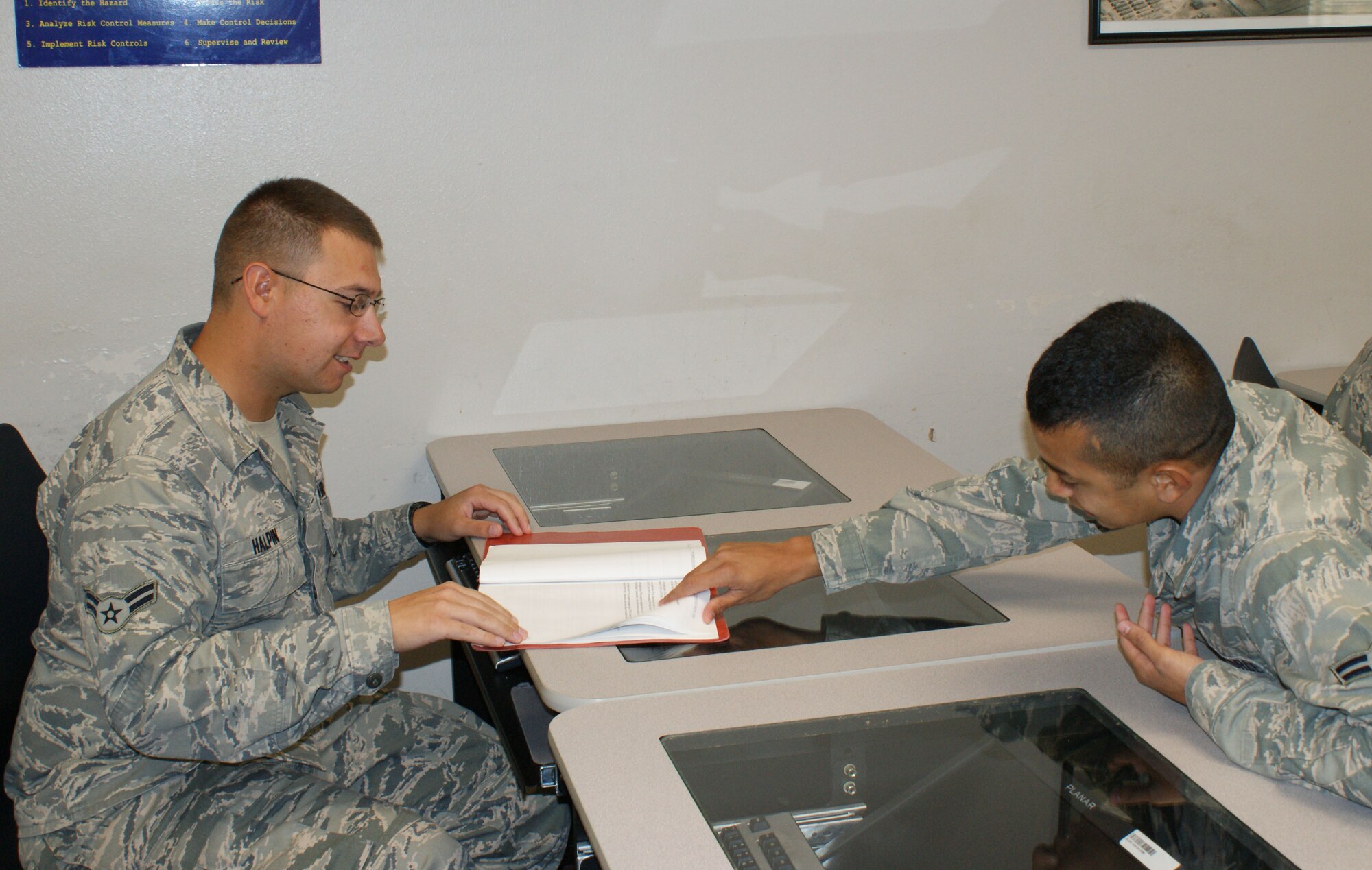 Airman 1st Class Justin Halpin (left) works for a solution during a training problem with a classmate during the F-15/A-10 Avionics Attack Control Systems "A" shred apprentice course which covers radar and navigation principles  May 14, 2012 at Sheppard Air Force Base.  Halpin, on temporary duty from the 104th Fighter Wing at Barnes Air National Guard Base in Westfield, Mass., is the first-ever ACE Award recipient for the course and will also be the last due to a course reorganization. (U.S. Air Force photo/Dan Hawkins)