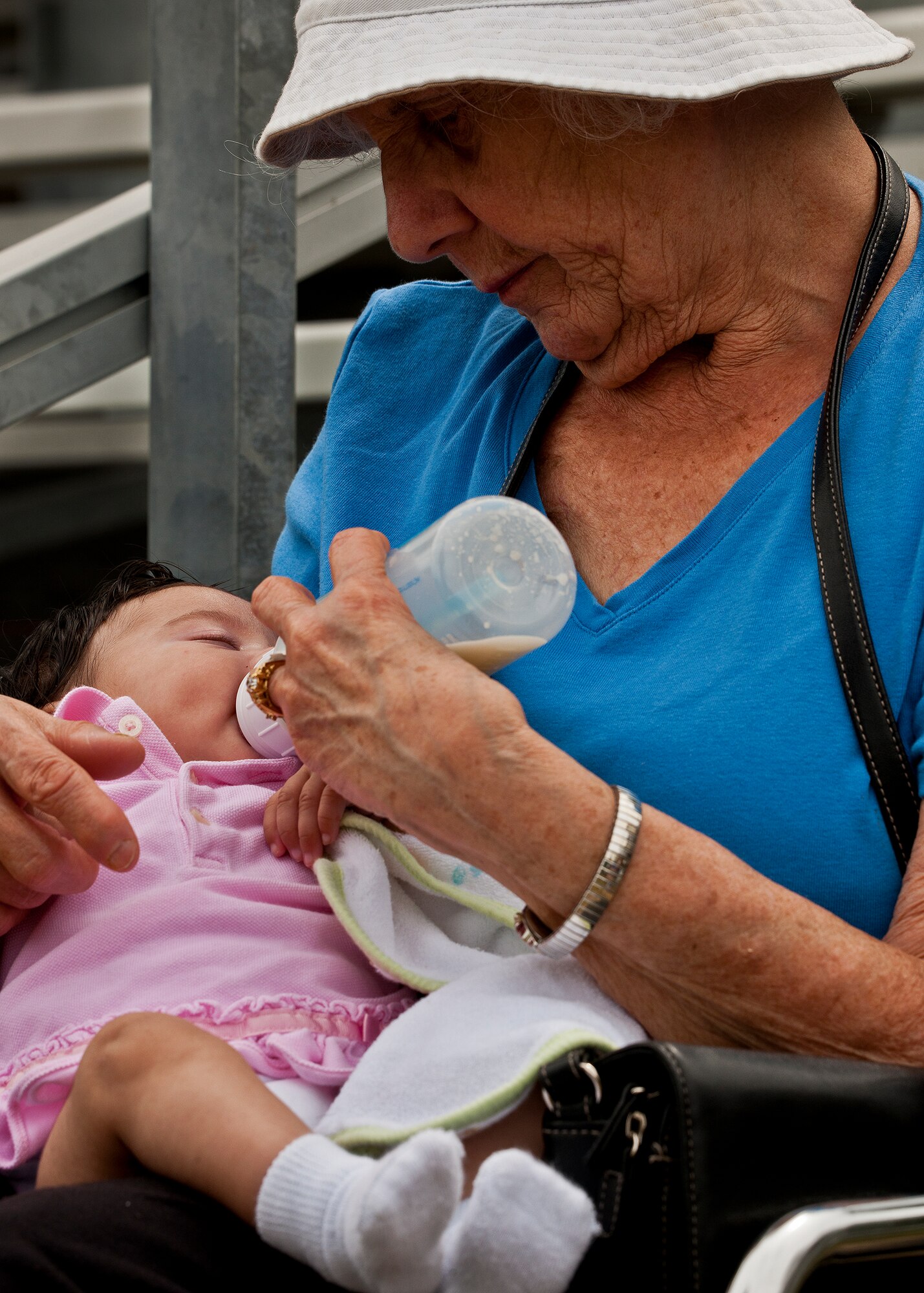 88-year-old Meriom Poliquin feeds her 2-month-old granddaughter, Desiree Lang, during the 6th Ranger Training Battalion’s annual open house event, May 12 at Eglin Air Force Base, Fla.  Poliquin said she journeyed down from New Hampshire to see her son, Staff Sgt. Corey Lang, a 6th RTB instructor, perform in one of the Ranger demonstrations.  (U.S. Air Force photo/Samuel King Jr.)