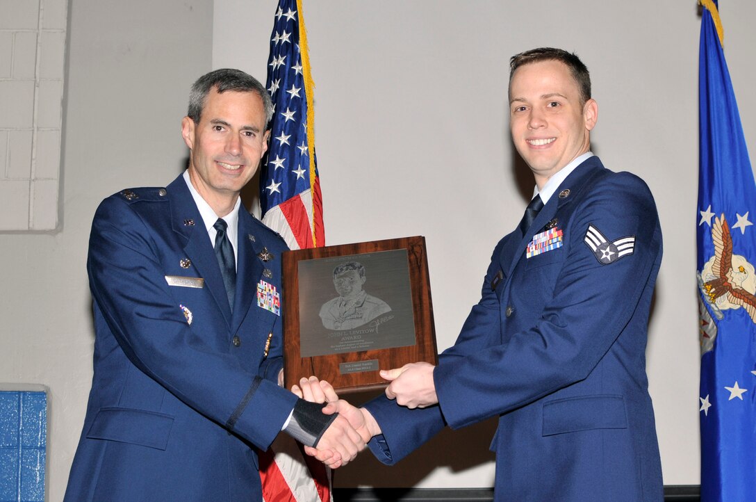 McGHEE TYSON AIR NATIONAL GUARD BASE, Tenn. - Senior Airman Daniel D. Rankin, right, receives the John L. Levitow honor award for Airman Leadership School Class 12-3 at the I.G. Brown Training and Education Center from Timothy J. Cathcart, commander, April 12, 2012. The John L. Levitow award is the highest honor awarded a graduate of any Air Force enlisted professional military education course. (Air National Guard photo by Master Sgt. Kurt Skoglund/Released) 