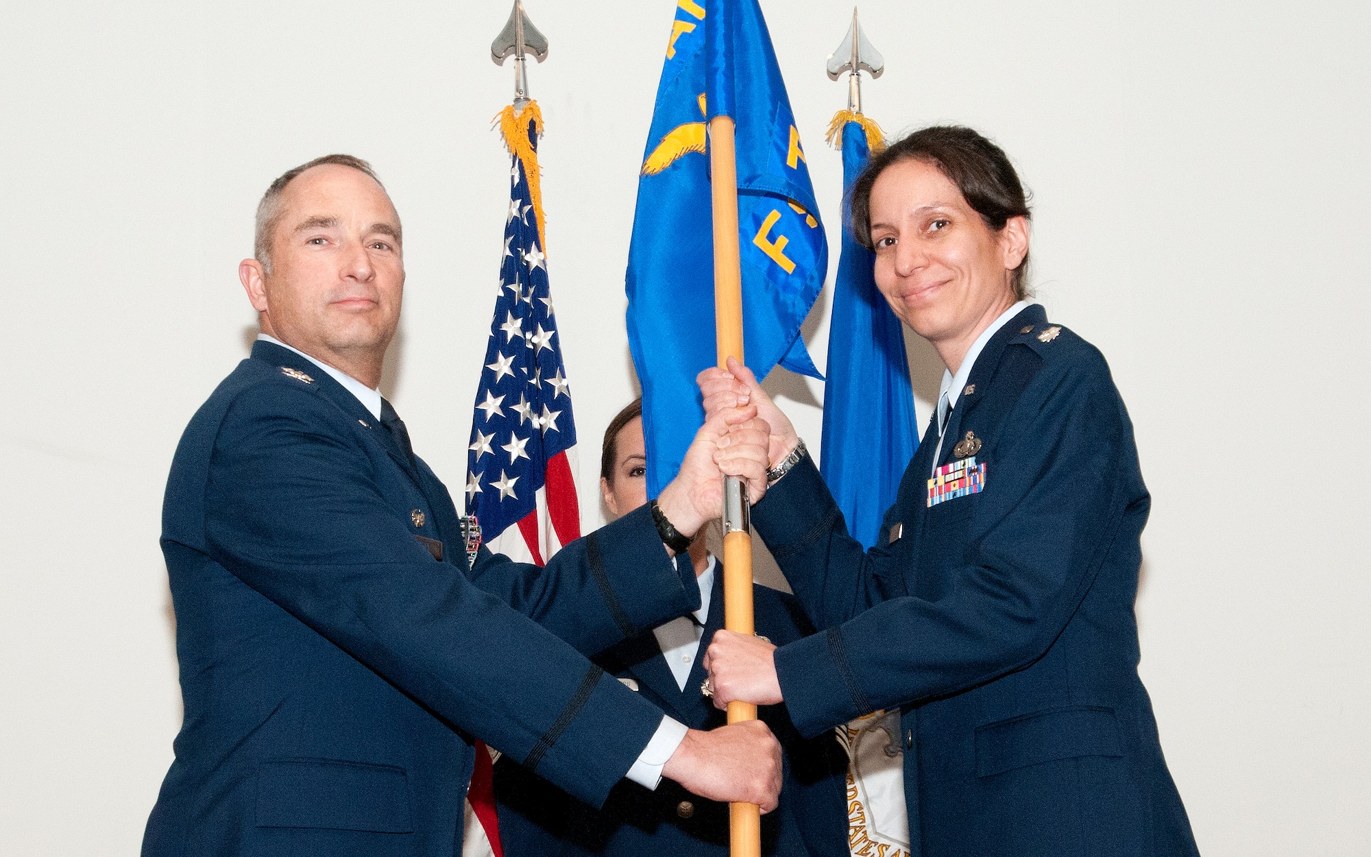 JOINT BASE ANDREWS, Md. -- Col. Scott S. Russell, 459th Mission Support Group commander, passes the guidon to Lt. Col. Jena L. Silva during an assumption of command cermony here May, 13, 2012. Silva is taking command of the 459th Force Support Squadron, a Reserve unit under the 459th MSG. (U.S. Air Force photo/Tsgt. Steve Lewis)