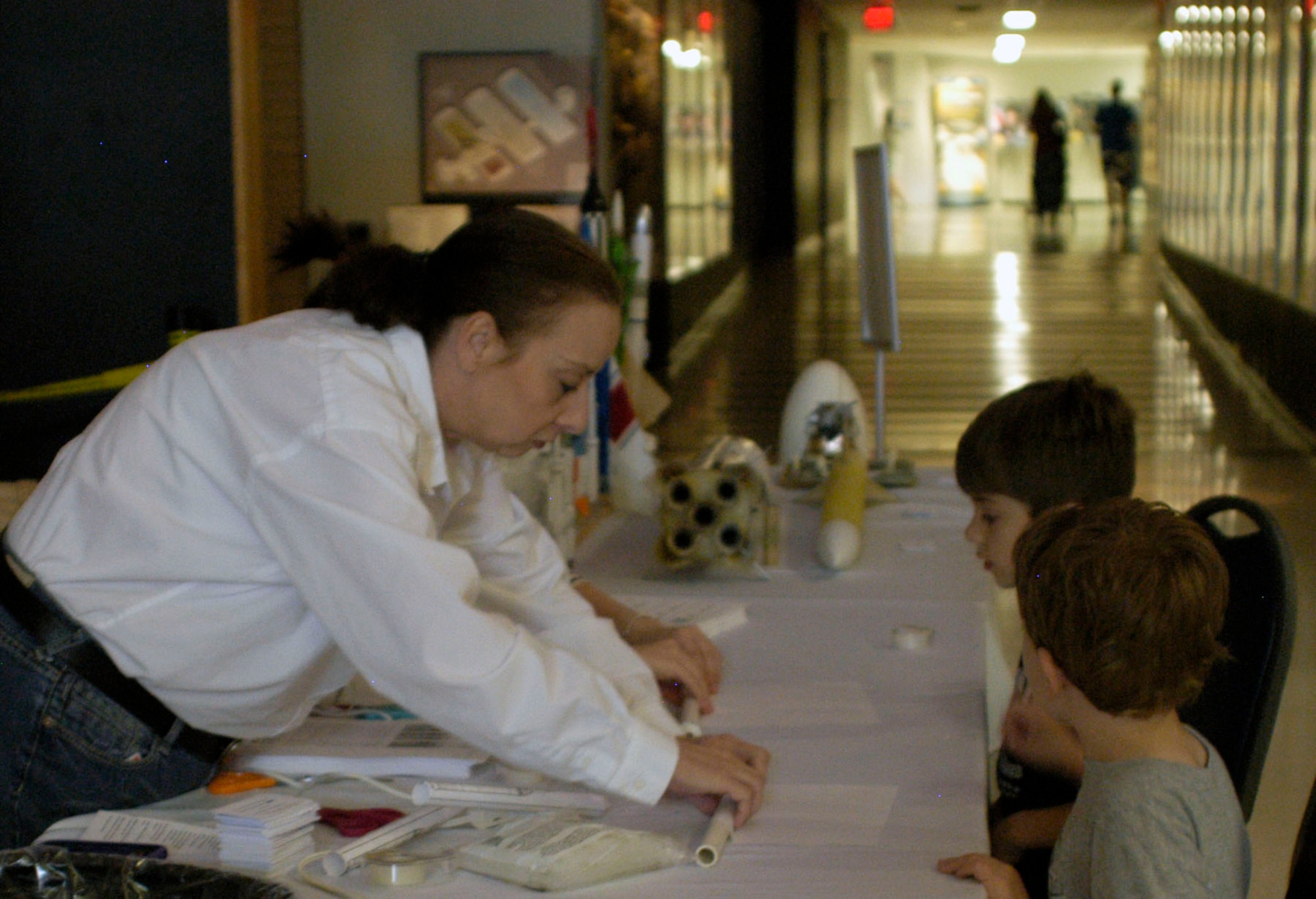 DAYTON, Ohio (05/2012) -- Visitors build paper rockets with the Columbus Model Rocketry School during Space Fest on May 12 at the National Museum of the U.S. Air Force. (U.S. Air Force photo)