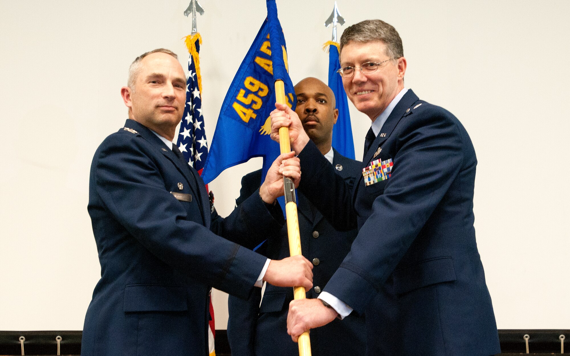 JOINT BASE ANDREWS, Md. -- Col. Scott S. Russell, 459th Mission Support Group commander, passes the guidon to Lt. Col. Stephen M. Higgins during an assumption of command cermony here May, 12, 2012. Higgins is taking command of the 759th Logisitcs Readiness Flight, a Reserve unit under the 459th MSG. (U.S. Air Force photo/Tsgt. Steve Lewis)