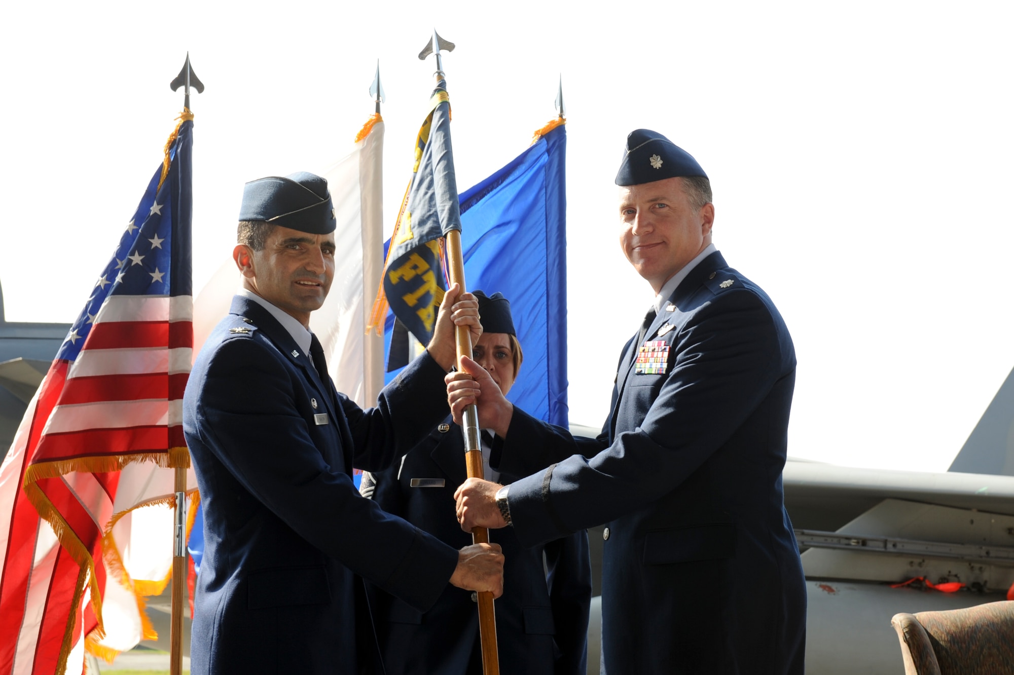 U.S. Air Force Lt. Col. David Eaglan takes command of the 44th Fighter Squadron from U.S. Air Force Col. David Nahom, 18th Operations Group commander, during a change of command ceremony on Kadena Air Base, Japan, May 11, 2012. Eaglan was the 67th FS's director of operations before assuming command of the 44th FS. (U.S. Air Force photo by Airman 1st Class Brooke P. Beers)