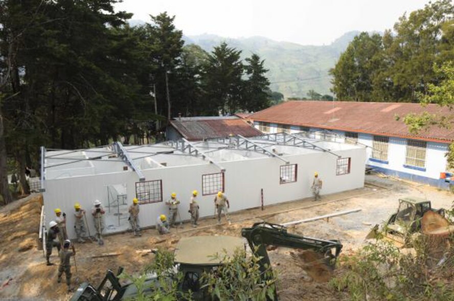 Airmen with the 188th Civil Engineering Squadron work at the Beyond the Horizon Guatemala 2012 Tactic site. This construction project will be an addition to the Centro de Salud medical clinic, nearly doubling its square footage, and will serve the community of Tactic as a women’s clinic. The 188th CES is currently deployed to Guatemala as part of a six-week rotation. (U.S. Army photo by 2nd Lt. Harold D. Williams/Task Force Arriero Public Affairs)