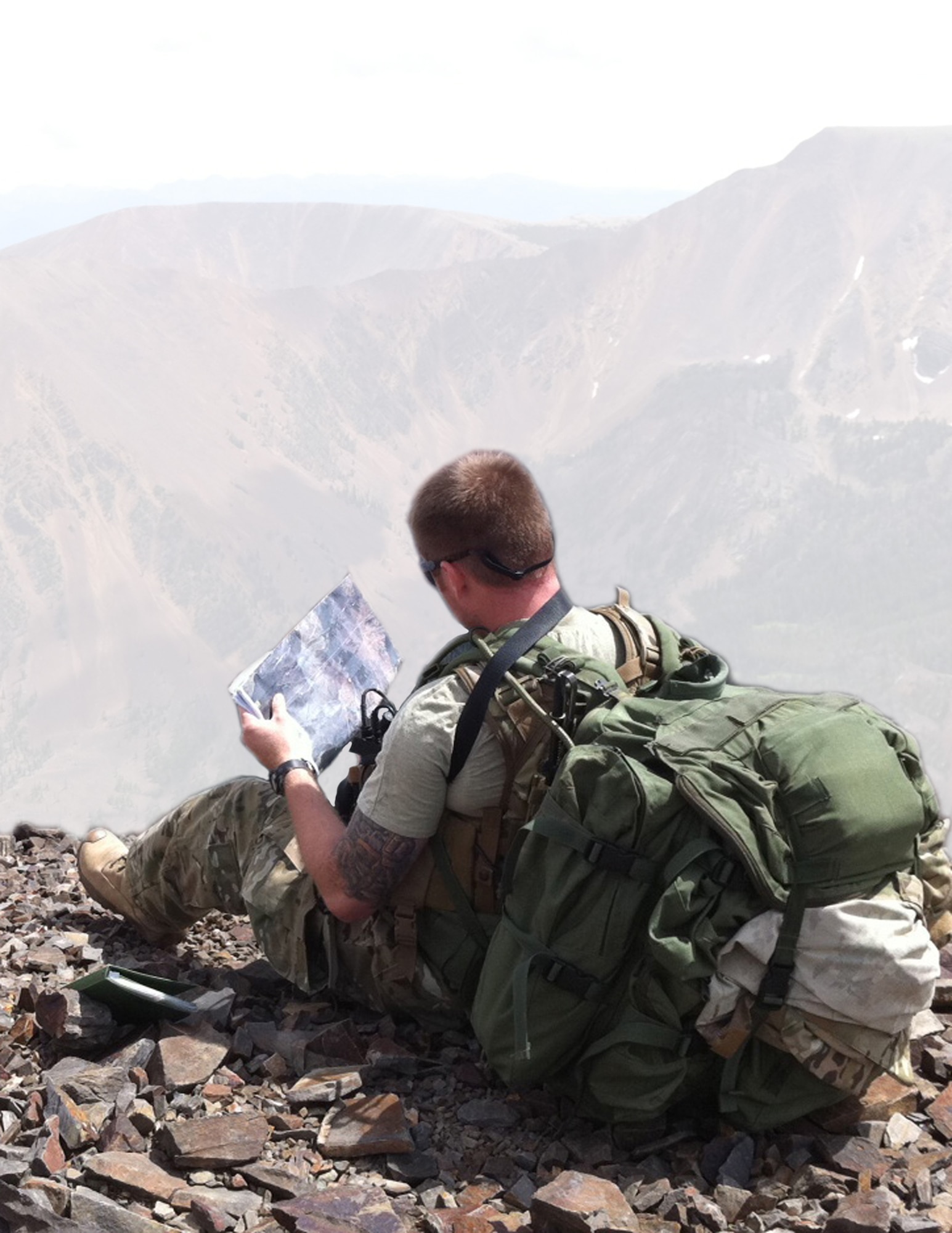 Master Sgt. Anthony Hobson, 113th Air Support Operation Squadron, utilizes detailed satellite imagery to plan a route through extremely aggressive terrain during a high altitude patrol in Butte, Mont.  Photo provided by 113th ASOS