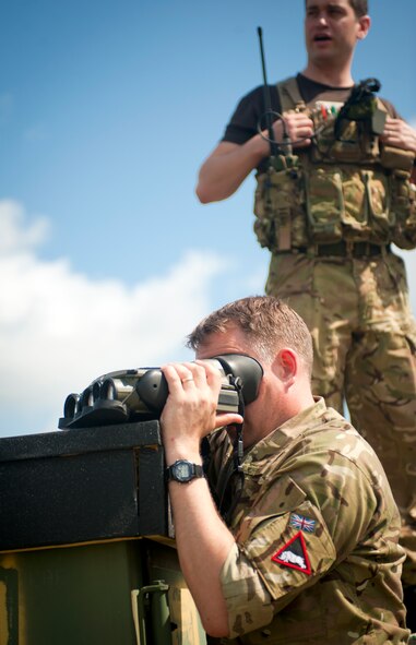 Royal Air Force Sgt. (Tech. Sgt.) Mark O’Brien, 1st Armored Division air ground communications technician, uses a Laser Rangefinder and Television (LRTV) to observe targets from his observation post at Grand Bay Bombing and Gunnery Range, Ga., May 8, 2012. The LRTV uses a high-powered camera with infrared capabilities to help fire support team members identify and observe targets. (U.S. Air Force photo by Airman 1st Class Jarrod Grammel/Released)
