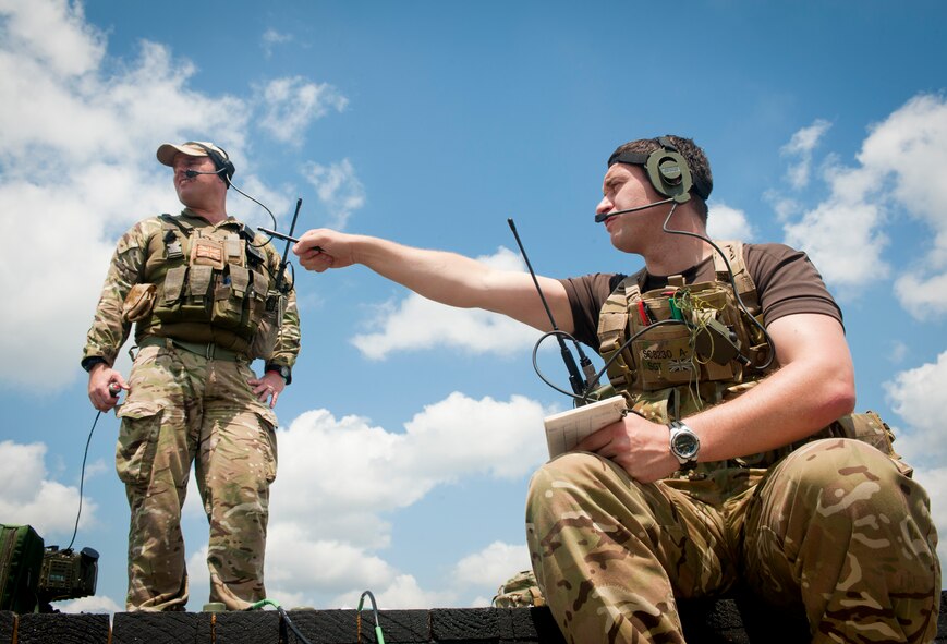 British army Sgt. (Tech. Sgt.) Lee Scaramuzza, 29th Commando Regiment joint terminal attack controller, and British army Sgt. Maj. (Master Sgt.) Gareth Thomas, 20th Armored Brigade JTAC instructor, identify targets for A-10C Thunderbolt IIs at Grand Bay Bombing and Gunnery Range, Ga., May 8, 2012. Pilots and JTACs regularly train with units from around the world that they might work with while deployed. (U.S. Air Force photo by Airman 1st Class Jarrod Grammel/Released)
