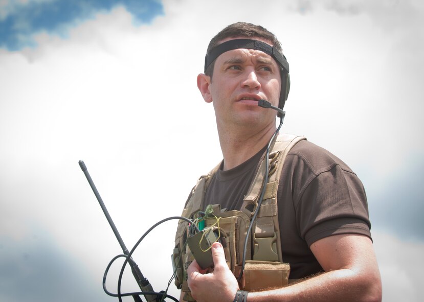 British army Sgt. (Tech. Sgt.) Lee Scaramuzza, 29th Commando Regiment joint terminal attack controller, uses a radio to communicate with A-10C Thunderbolt IIs during live fire training at Grand Bay Bombing and Gunnery Range, Ga., May 8. Five British service members trained at Moody and Naval Air Station Jacksonville, Fla. May 6 to 10. (U.S. Air Force photo by Airman 1st Class Jarrod Grammel/Released)
