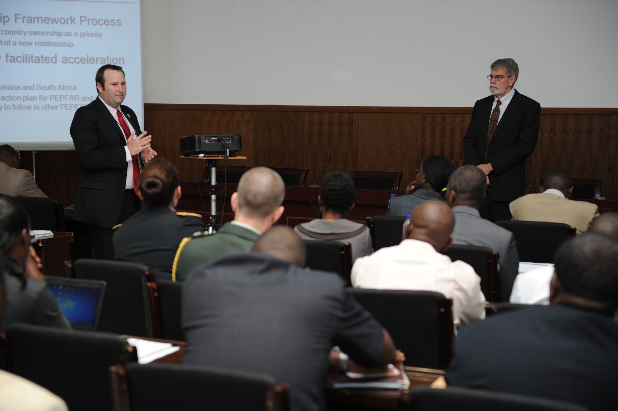 Will Conquest, Department of Defense HIV/AID Prevention Program, left, asks a question to U.S. Ambassador J. Anthony Holmes, deputy to the commander for civil-military activities U.S. Africa Command, during a break-out session with DHAPP program managers at the 2012 International Military HIV/AIDS Conference, May 10. Military and civilian delegates and subject matter experts from 77 nations gathered for the 2012 IMilHAC in Maputo, Mozambique, May 7-10, to share best practices in HIV prevention, care and treatment.