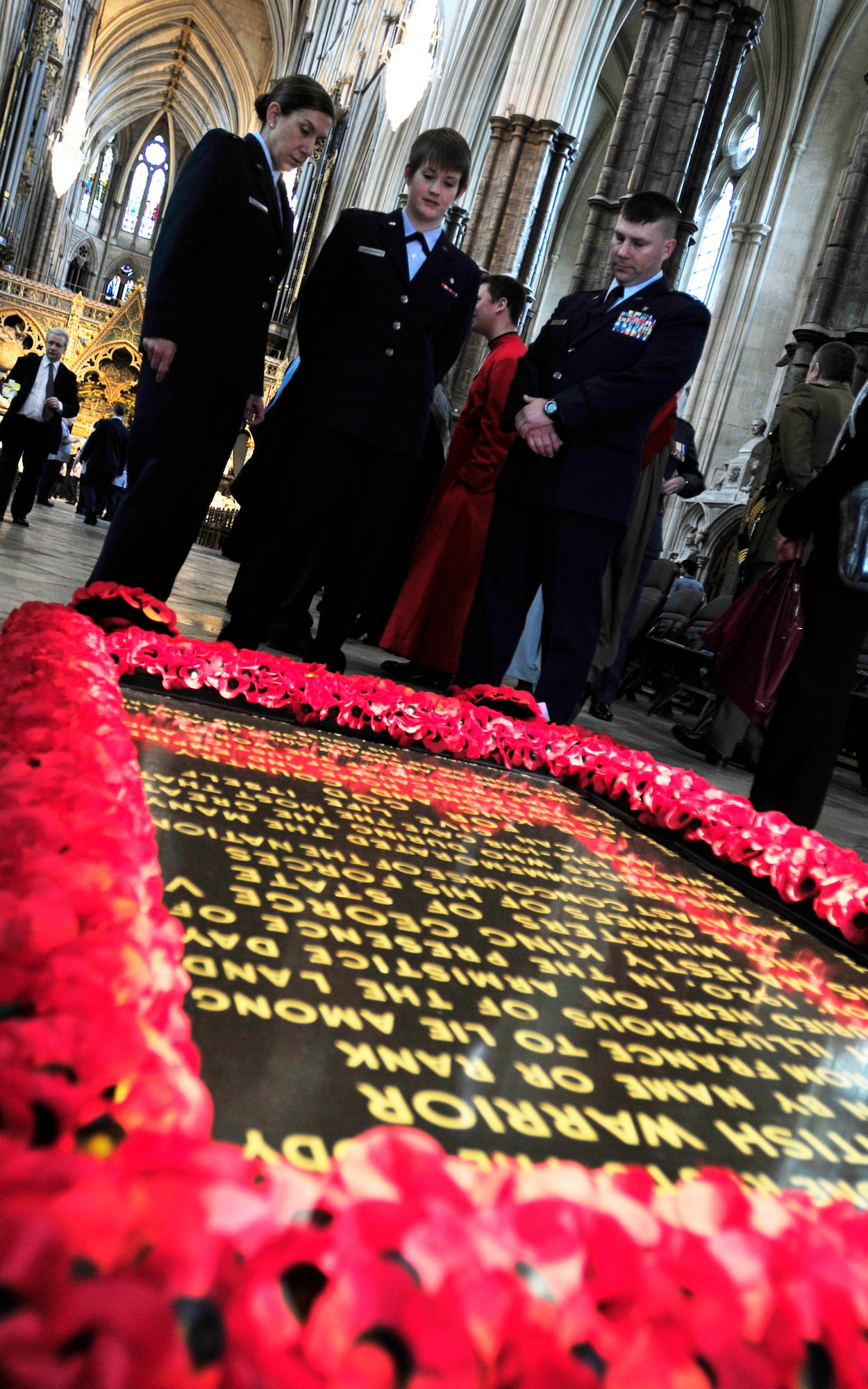 LONDON, England – (left to right) Capt. Jill Lemieux, 48th Medical Operations Squadron emergency services staff nurse, Lt. Sarah Leatherman, 48th Medical Surgical Squadron clinical nurse and Capt. Zachery Kalinauskas, 48th MDOS family health nurse, look at the grave of the unknown warrior at Westminster Abbey in London May 9, 2012. Over 40 Airmen and civilians from the 48th Medical Group went to London to visit the Florence Nightingale museum and participate in a service to commemorate the life of Florence Nightingale at Westminster Abbey. (U.S. Air Force photo by Senior Airman Tiffany M. Deuel) 