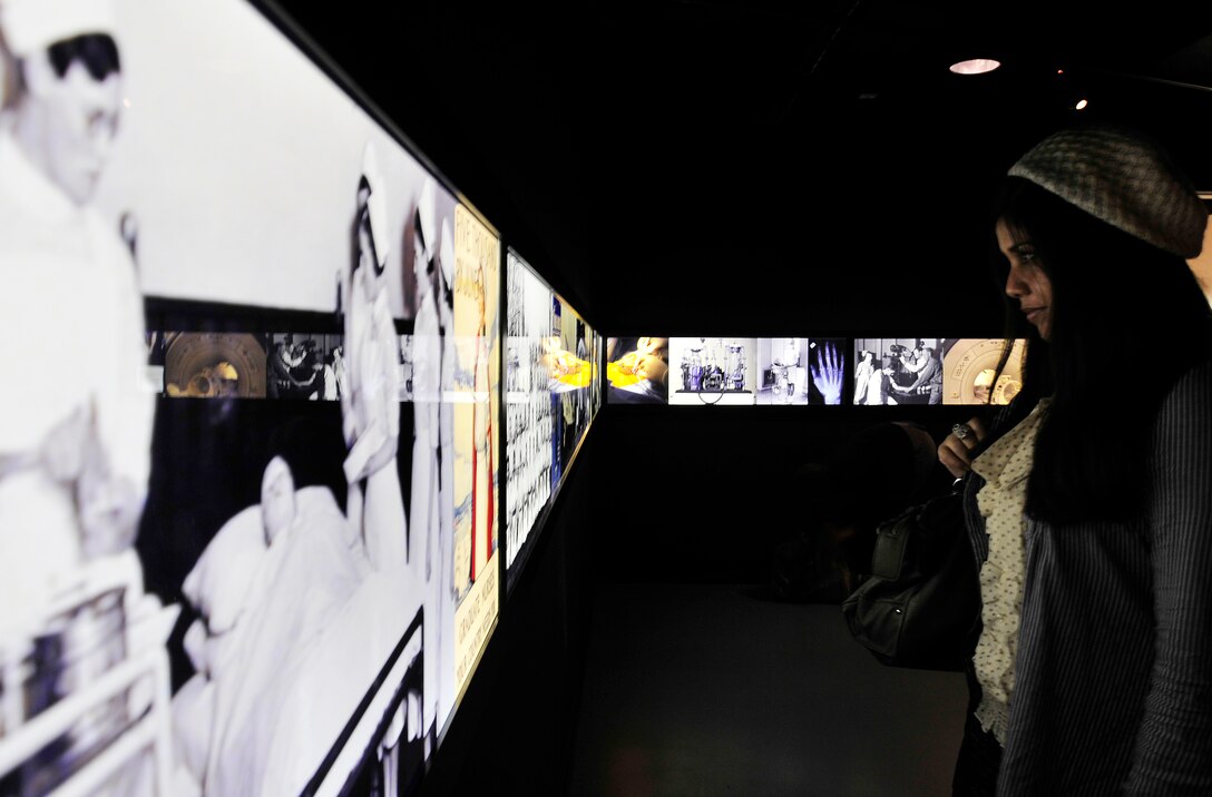 LONDON, England – Airman 1st Class Hyasmin Mendoza, 48th Aerospace Medical Squadron public health technician, looks at pictures at the Florence Nightingale Museum in London May 9, 2012. More than 40 Airmen and civilians from the 48th Medical Group went to London to visit the museum and participate in a service to commemorate the life of Florence Nightingale at Westminster Abbey. (U.S. Air Force photo by Senior Airman Tiffany M. Deuel) 