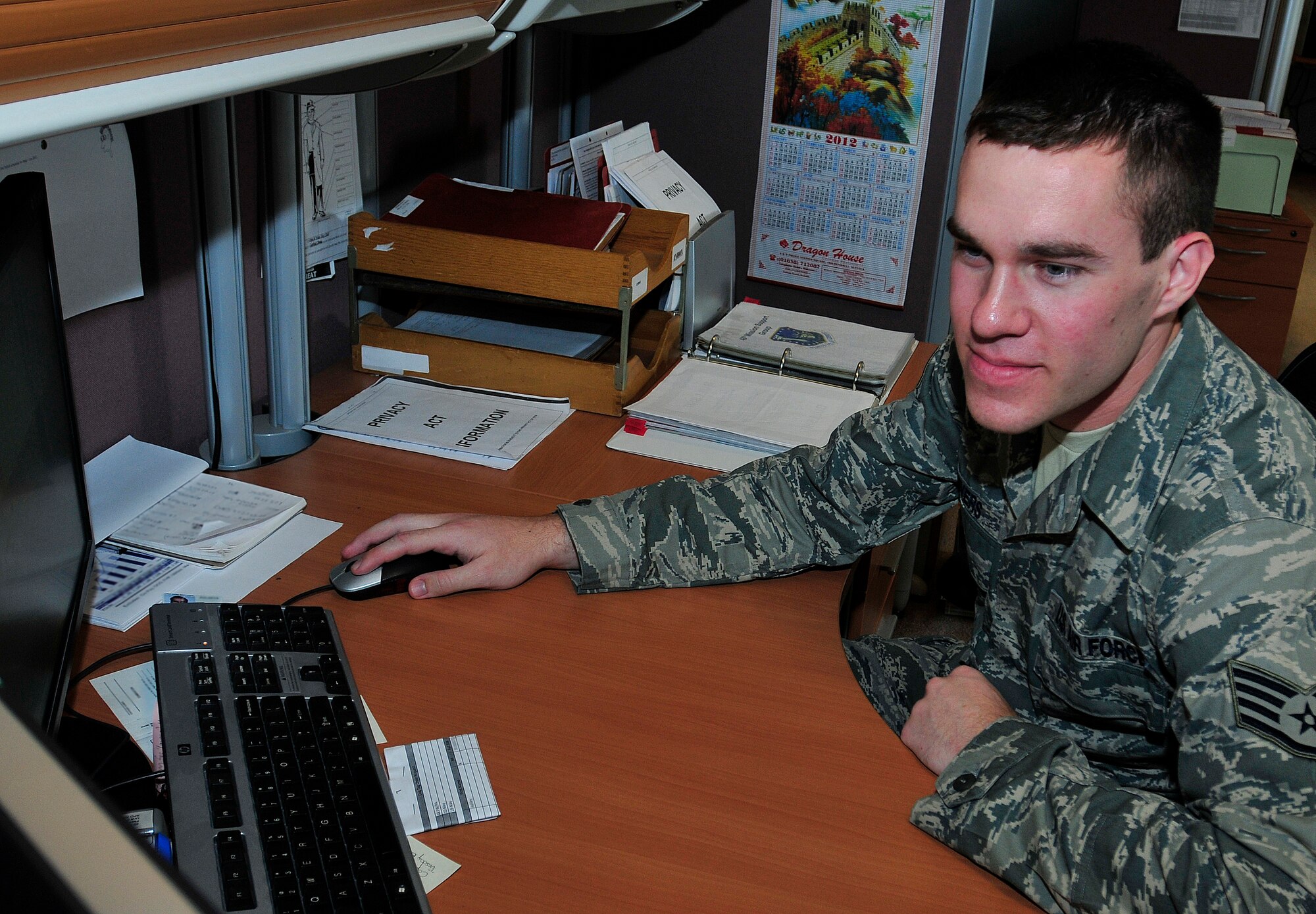 ROYAL AIR FORCE LAKENHEATH, England - Staff Sgt. Troy Rivers, 48th Comptroller Squadron financial analyst, inputs data into his computer March 21, 2012. Rivers was nominated for a Liberty Spotlight because he displays the core value of "Service Before Self." (U.S. Air Force photo by Senior Airman Tiffany M. Deuel)