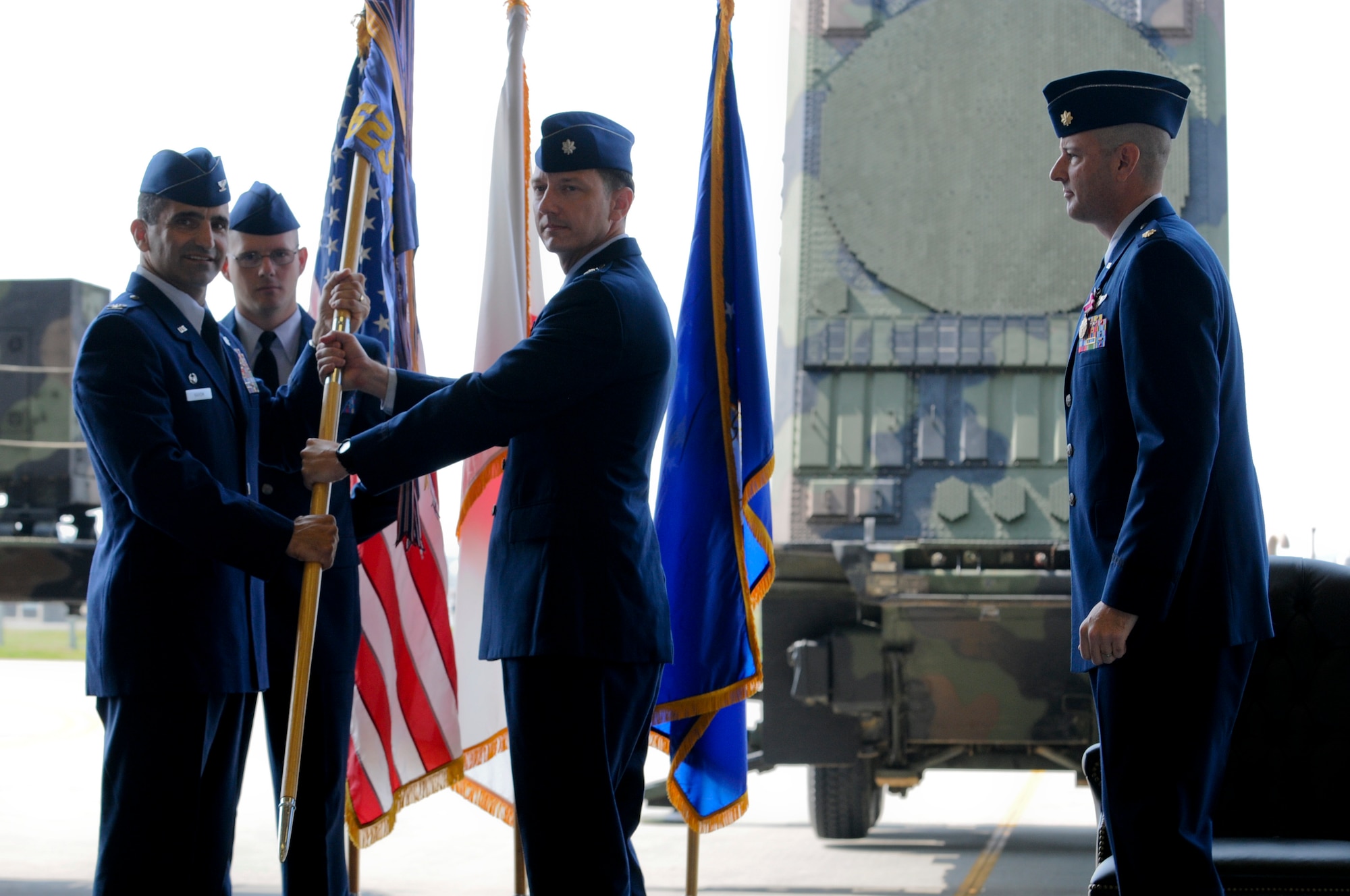 U.S. Air Force Lt. Col. Paul Nichols, 623rd Air Control Flight commander, assumes command by accepting the 623rd ACF flag from Col. David Nahom, 18th Operations Group commander, during a change of command ceremony May 11, 2012. Nichols gained command of the 623rd ACF, while U.S. Air Force Maj. Jeffery Watts, outgoing 623rd ACF commander, prepares to continue his advanced schooling for his career. (U.S. Air Force photo/Airman Tara A. Williamson)
