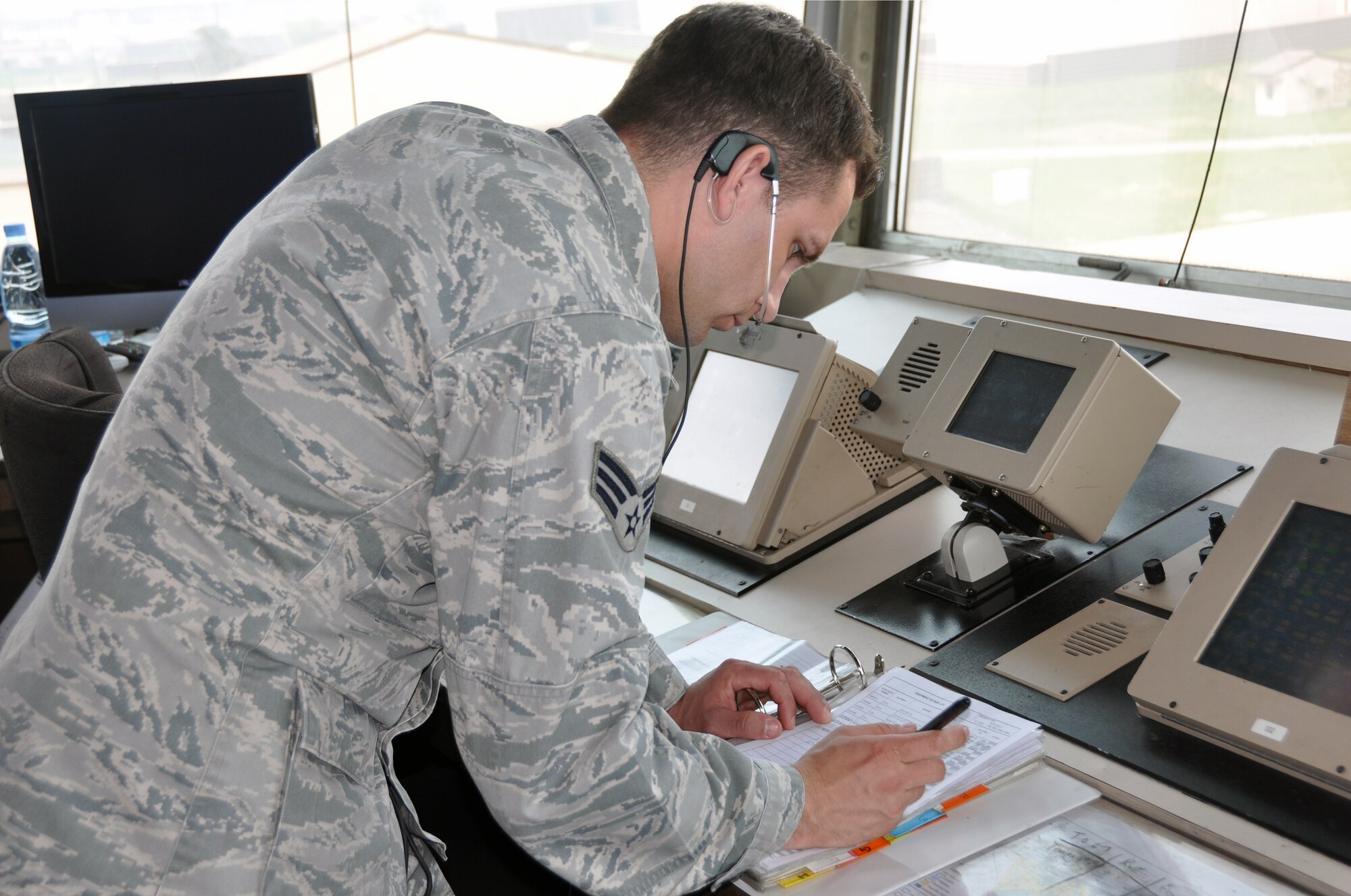 Senior Airman Kevin Voelz, 51st Operations Support Squadron air traffic controller, reviews an air traffic control technical manual at Osan Air Base, Republic of Korea, May 9, 2012. (U.S. Air Force photo/Airman 1st Class Michael Battles)