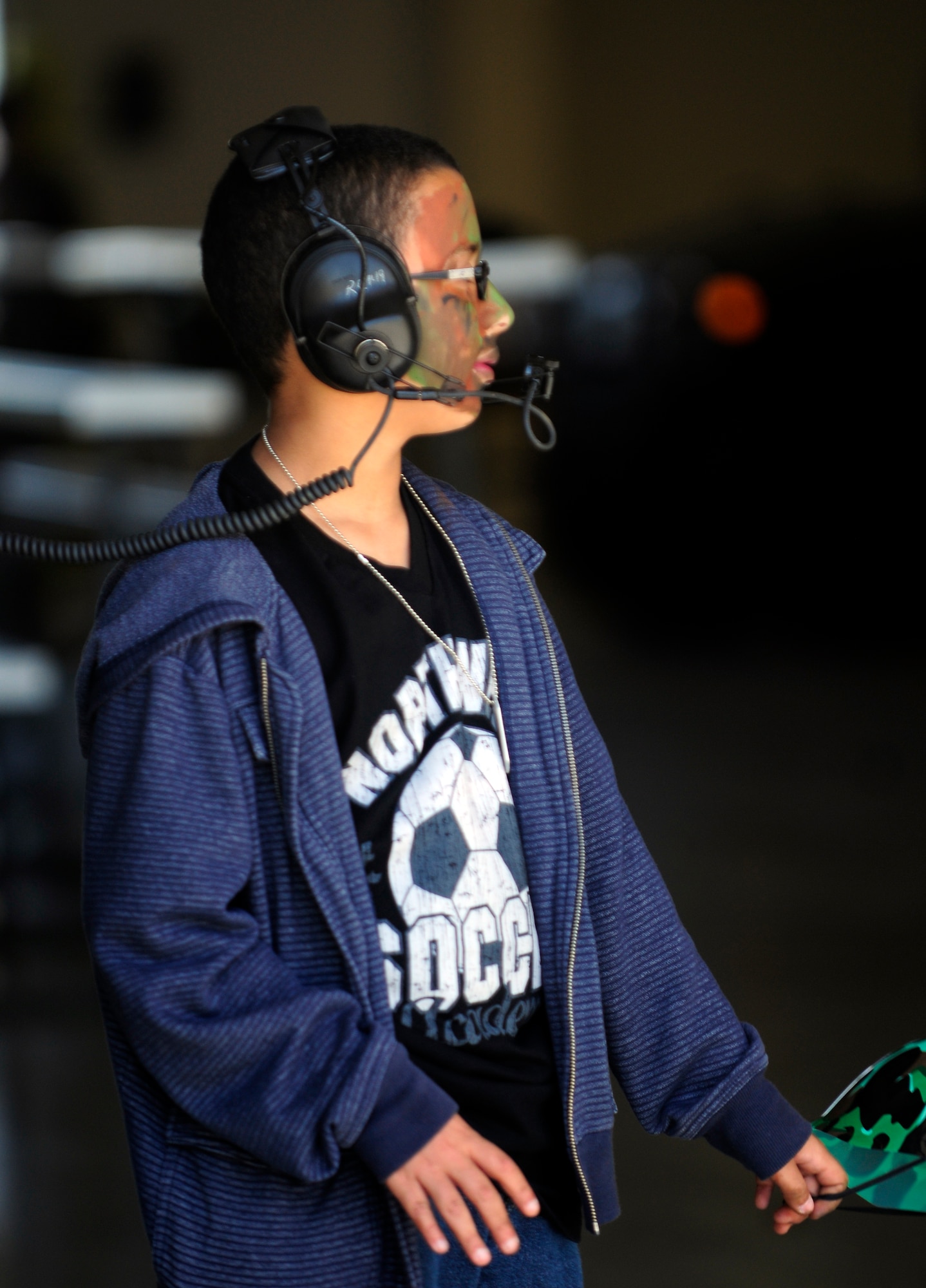 Yodiel, son of Franseco Rodriguez, tries on tactical radio gear during Aviano's Children's Deployment Line May 8 at Aviano Air Base, Italy. The 603rd Air Control Squadron hosted the simulated deployment line for children from Aviano Elementary and Middle schools along with homeschoolers, with help from voulnteers from around base. (U.S. Air Force photo/Airman 1st Class Briana Jones)