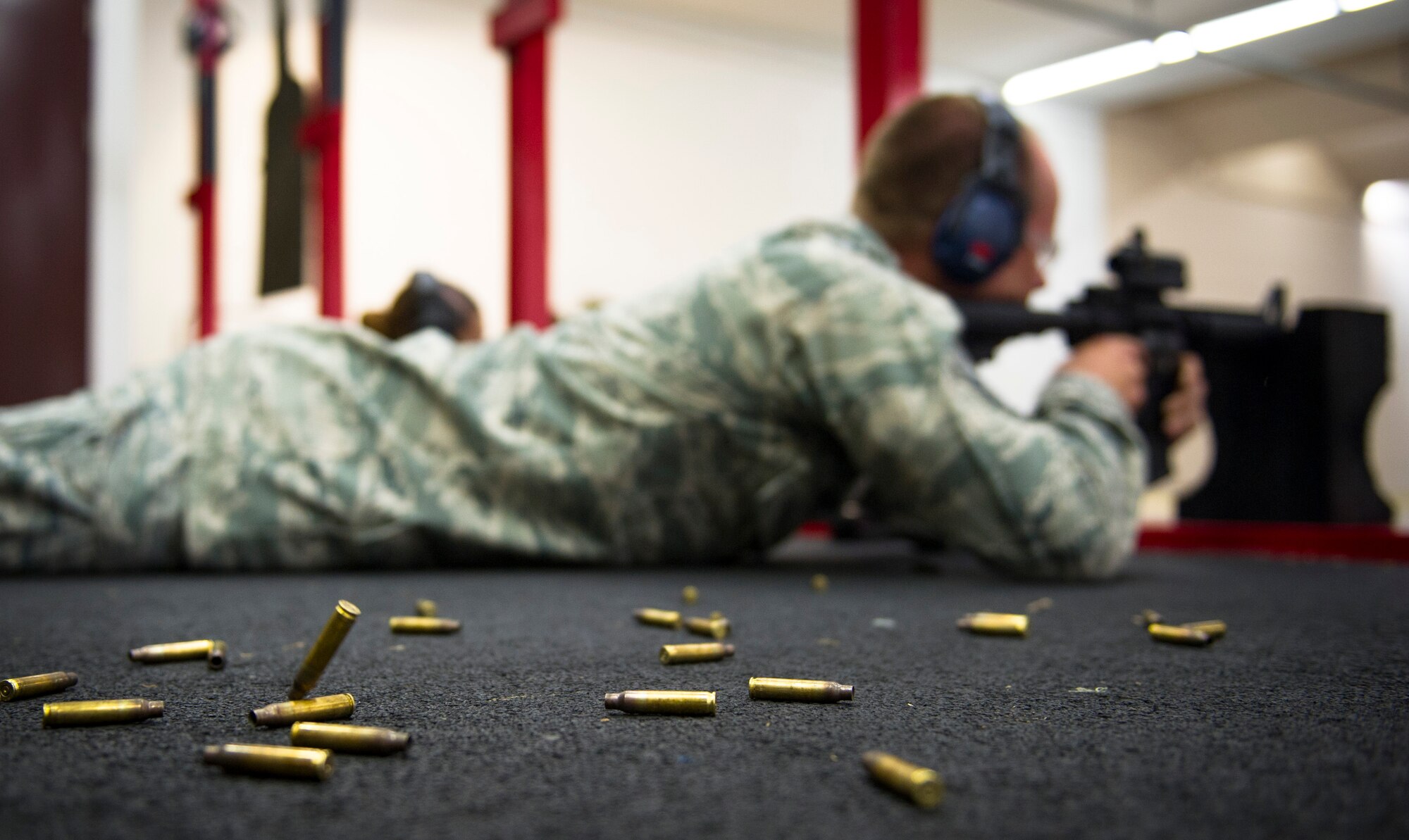 YOKOTA AIR BASE, Japan -- Master Sgt. Lance Backman, 374th Force Support Squadron fitness section chief, fires several rounds with an M4 rifle during weapons qualification May 10, 2012, at Yokota Air Base, Japan. In order to qualify, Airmen shoot approximately 196 rounds from several different positions. (U.S. Air Force photo by Staff Sgt. Chad C. Strohmeyer)