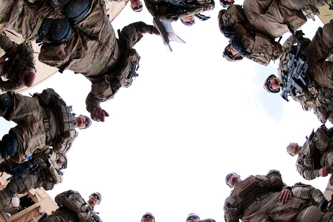 U.S. Army paratroopers listen to a briefing before a patrol with Afghan soldiers in Afghanistan's Ghazni province, May 8, 2012. The soldiers are assigned to the 82nd Airborne Division’s 2nd Battalion, 504th Parachute Infantry Regiment, 1st Brigade Combat Team. The battalion deployed to Ghazni in March 2012 to help bring security to Highway 1, the country’s most important road for travel between Kabul and Kandahar.