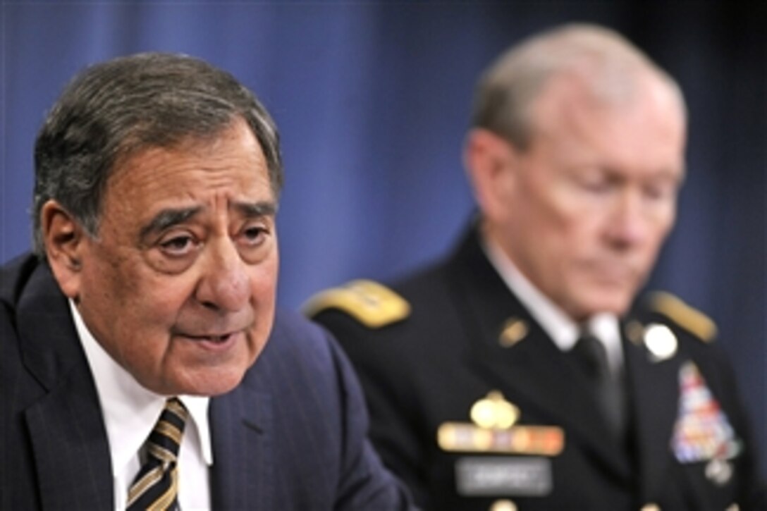 Secretary of Defense Leon E. Panetta answers a reporter's question as he and Chairman of the Joint Chiefs of Staff Gen. Martin E. Dempsey hold a press conference in the Pentagon on May 10, 2012.  