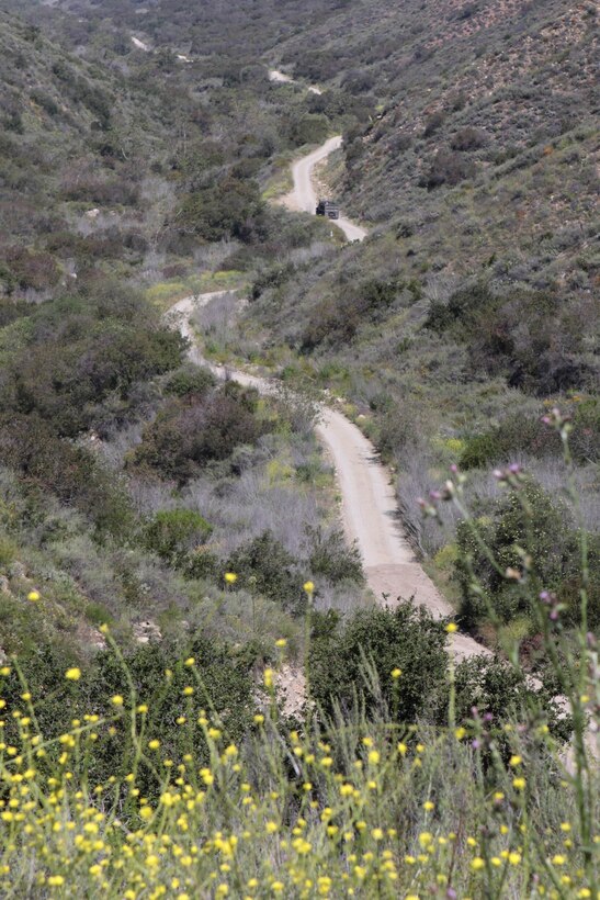 Construction Battalion Maintenance Unit 303, San Diego is working to reconstruct the San Mateo Live-Fire Training Convoy Course on Marine Corps Base Camp Pendleton, May 17. One and a half mile of this five-mile long training course has a six percent grade, making it one of the steepest roads on base. Extreme erosion due to heavy rain and excessive use made this road increasingly perilous to navigate.
