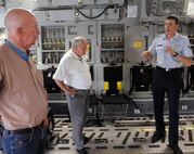 Don J. Jenkins, and Kenneth E. Stumpf, retired U.S. Army soldiers and Congressional Medal of Honor recipients, listen to Airman 1st Class Aleksandar Joga, 535th Airlift Squadron loadmaster, on C-17 Globemaster III load capabilities May 14 at Joint Base Pearl Harbor-Hickam, Hawaii. The Medal of Honor is the highest award for valor in action against an enemy force which can be bestowed upon an individual serving in the Armed Services of the United States and is generally presented to its recipient by the President of the United States of America in the name of Congress. (U.S. Air Force photo by Staff Sgt. Nathan Allen) 