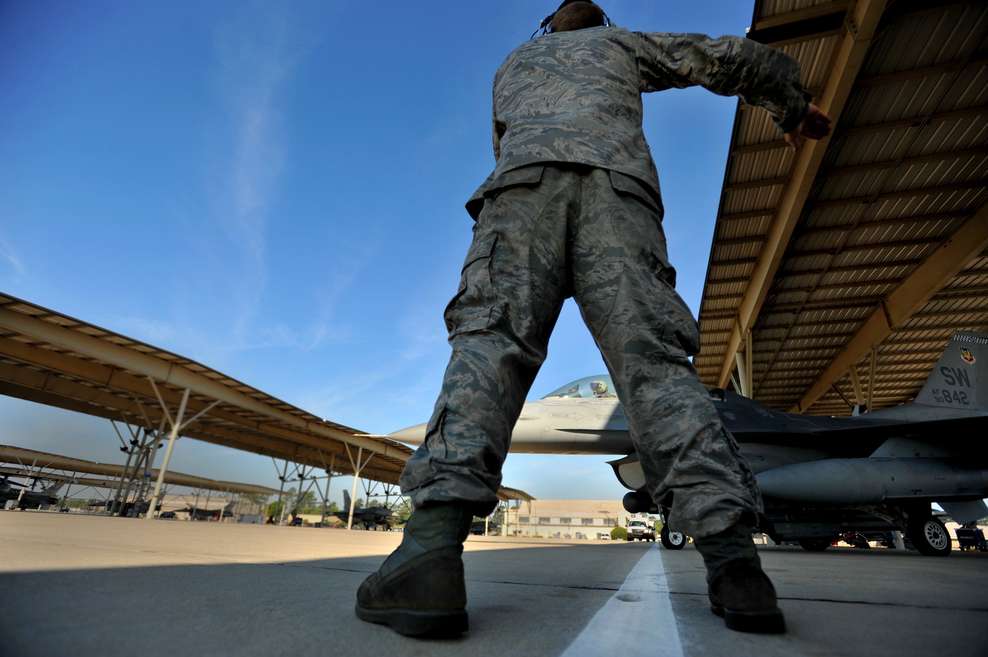 U.S. Air Force Senior Airman Kelvin DeCato, 20th Aircraft Maintenance Squadron crew chief, launches an F-16 Fighting Falcon, April 13, 2012, Shaw Air Force Base, S.C. Shaw's F-16 Fighting Falcon fleet is the number one asset that aids pilots when providing combat-ready airpower anytime, anywhere. (U.S. Air Force photo by Senior Airman Kenny Holston/Released)


