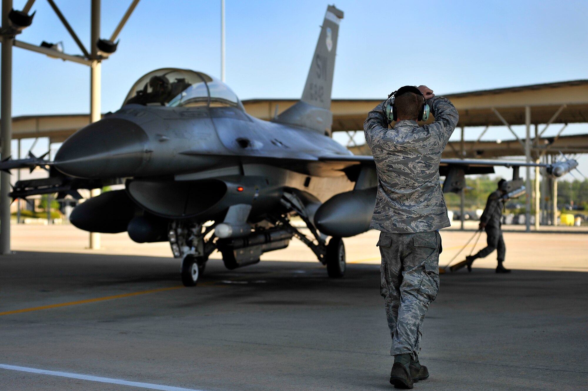 U.S. Air Force Senior Airman Kelvin DeCato, 20th Aircraft Maintenance Squadron crew chief. launches an F-16 Fighting Falcon, April 13, 2012, Shaw Air Force Base, S.C. Shaw's F-16 Fighting Falcon fleet is the number one asset that aids pilots when providing combat-ready airpower anytime, anywhere. (U.S. Air Force photo by Senior Airman Kenny Holston/Released)



